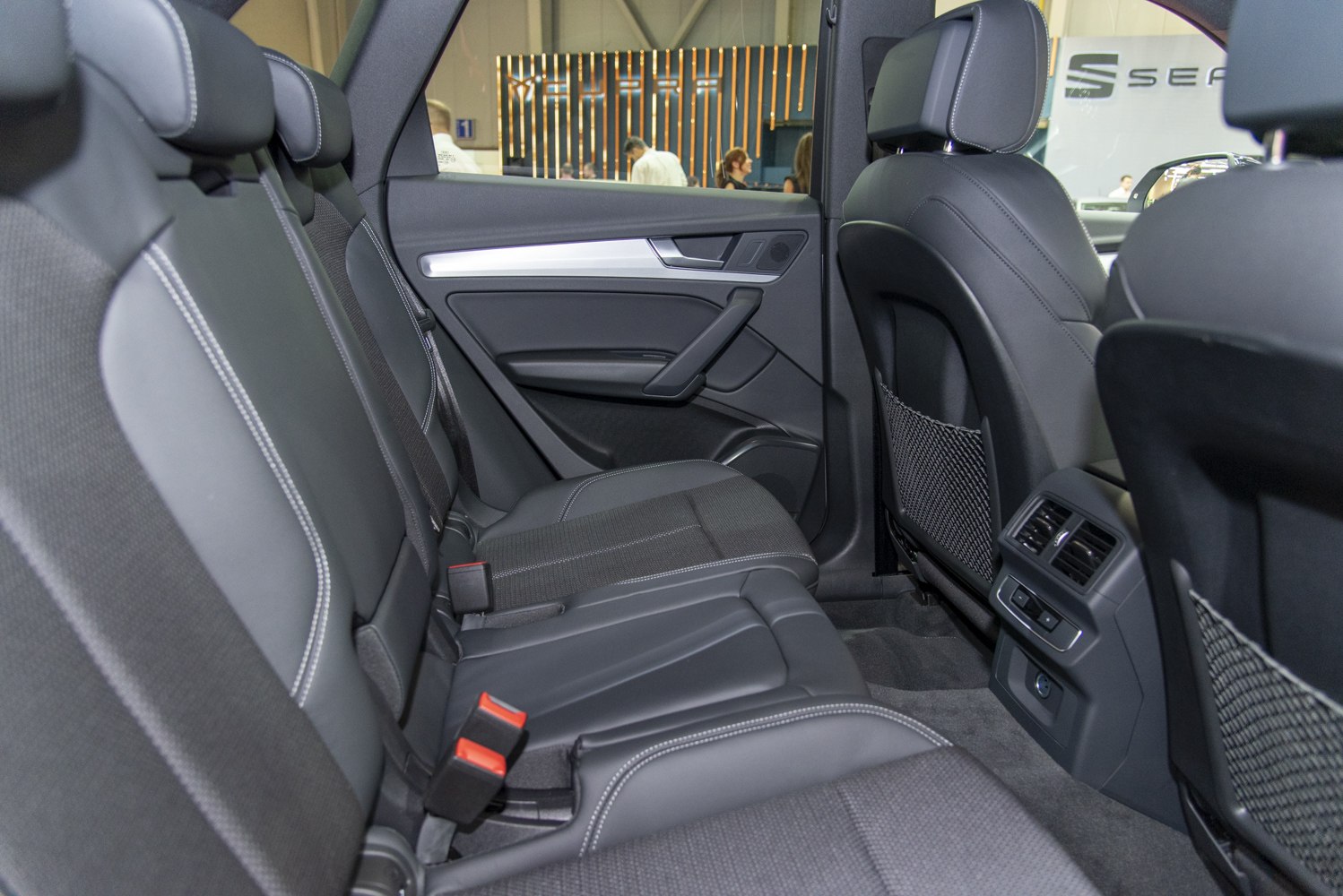 Rear passenger seat interior with leather and fabric upholstery