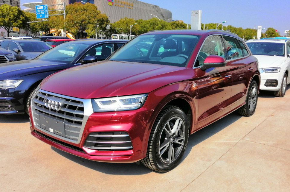 Red luxury SUV with LED headlights and alloy wheels
