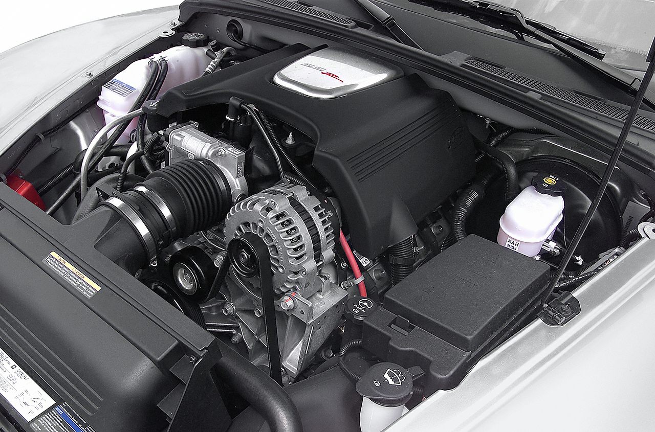 V8 engine bay with intake, alternator, and fluid reservoirs