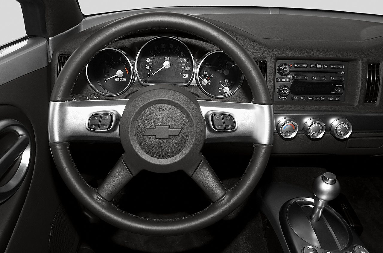Dashboard with instrument cluster and steering wheel