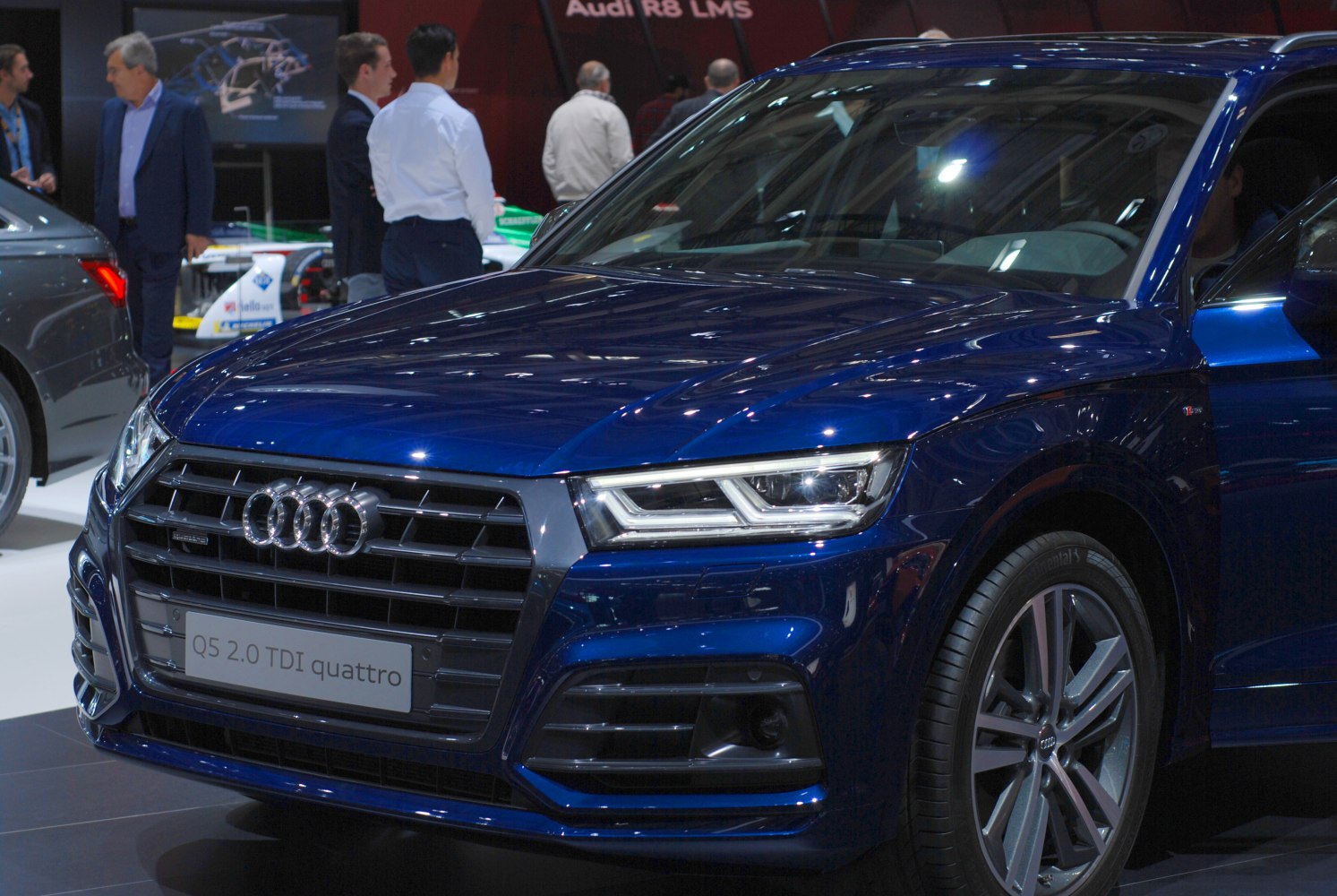 Close-up of front grille and LED headlights on premium blue SUV