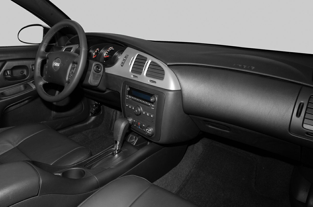 Dashboard, steering wheel, center console, and leather seats interior