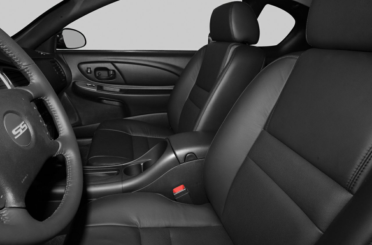 Leather seats and sporty steering wheel in front car interior