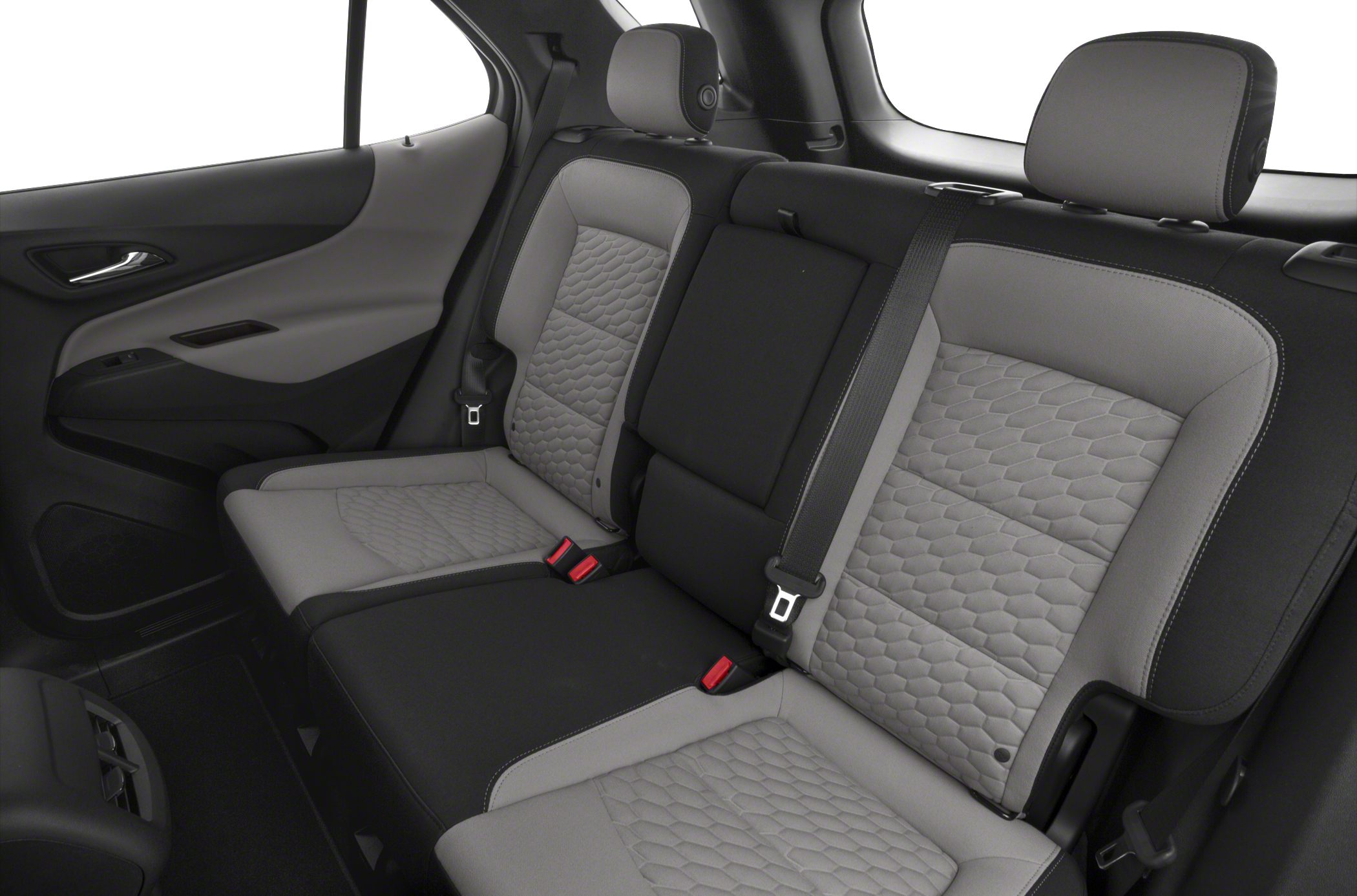 Quilted upholstery rear seats with adjustable headrests and seat belts.