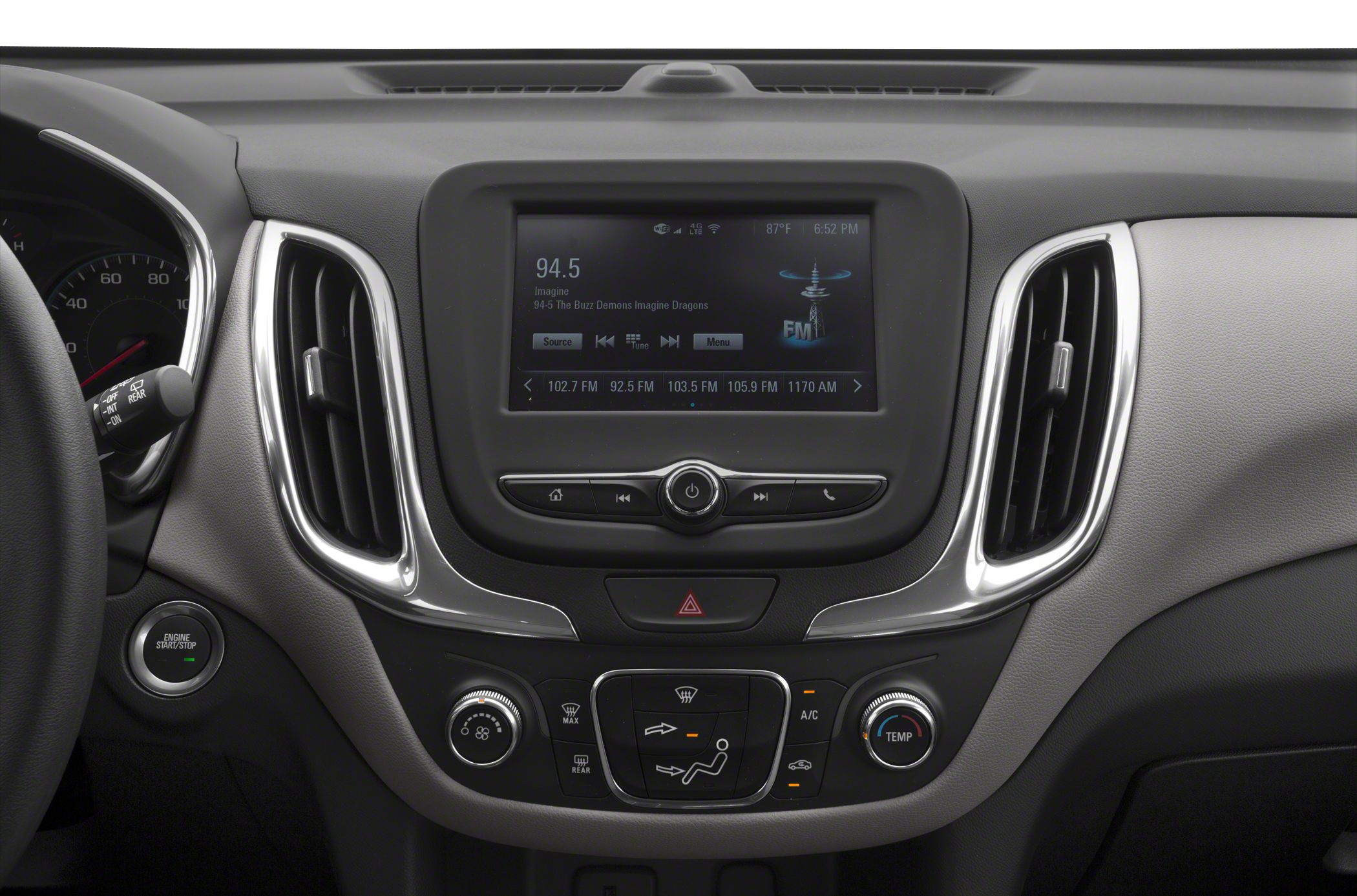 Infotainment screen with climate control knobs and air vents