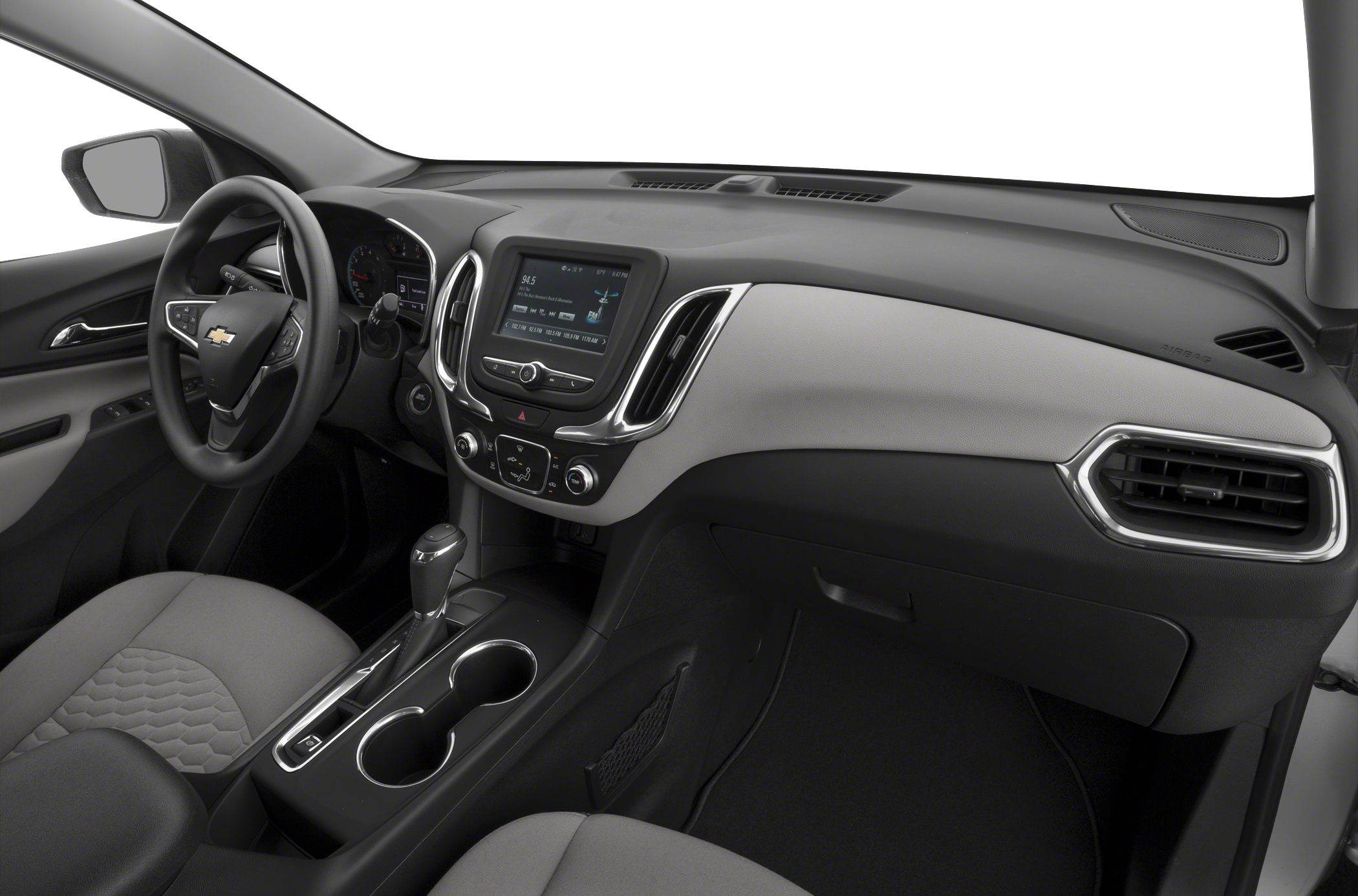 Modern SUV interior with dashboard, infotainment screen, and center console.
