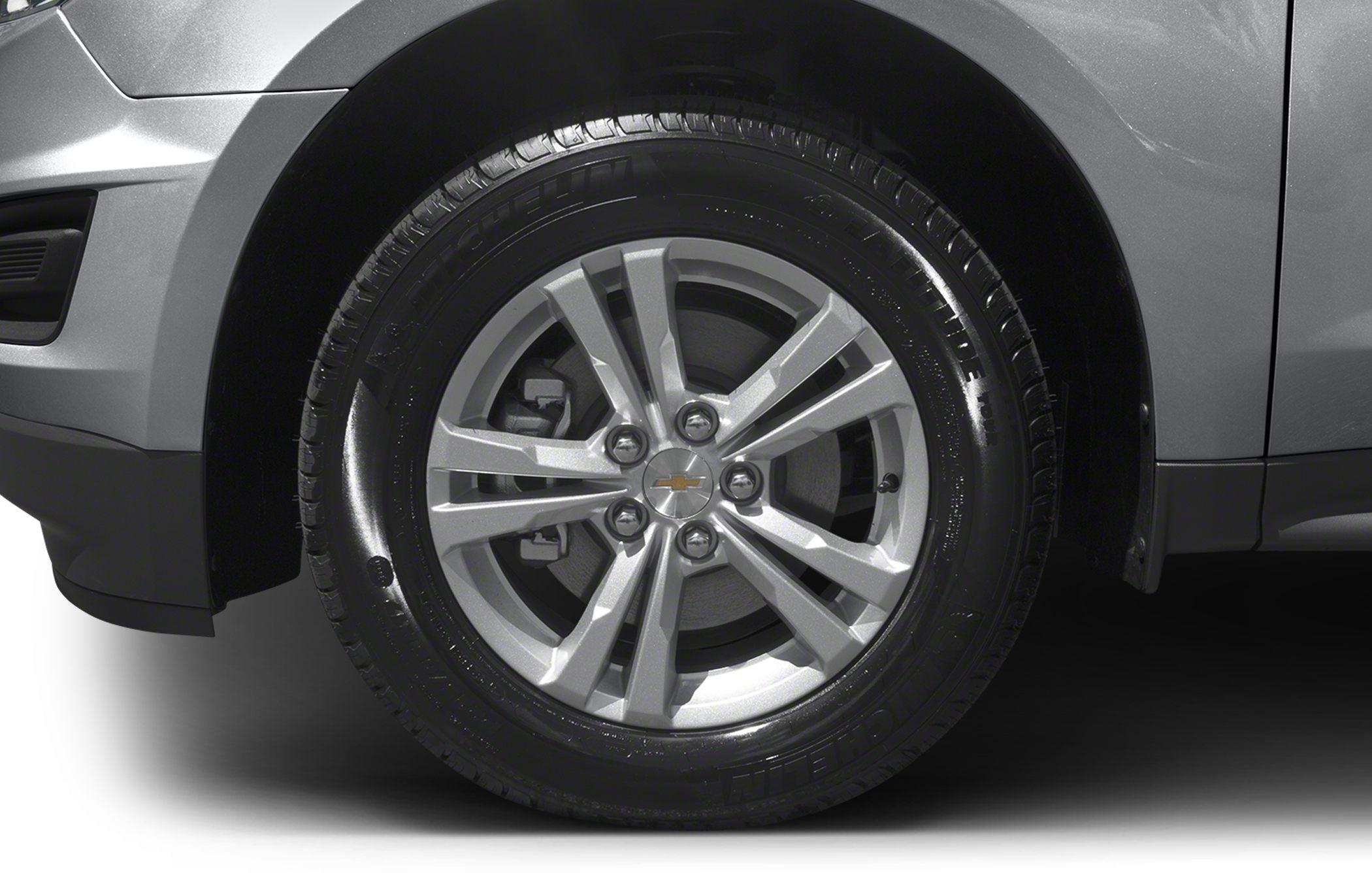 Close-up of alloy wheel and tire with emblem