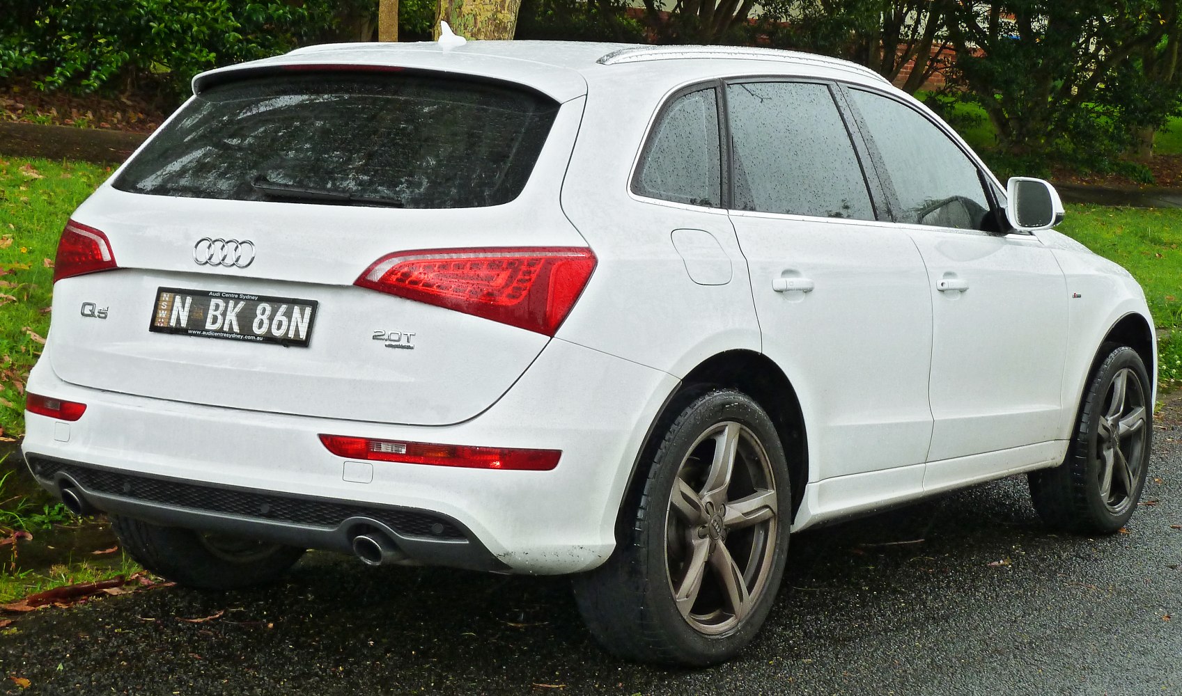Rear view with distinctive taillights and dual exhaust pipes