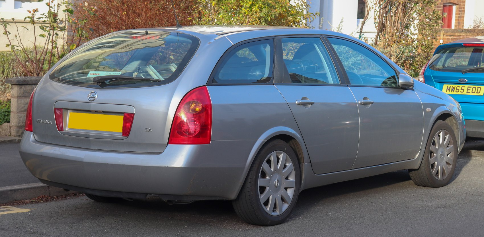 Silver station wagon rear side with distinctive tail lights