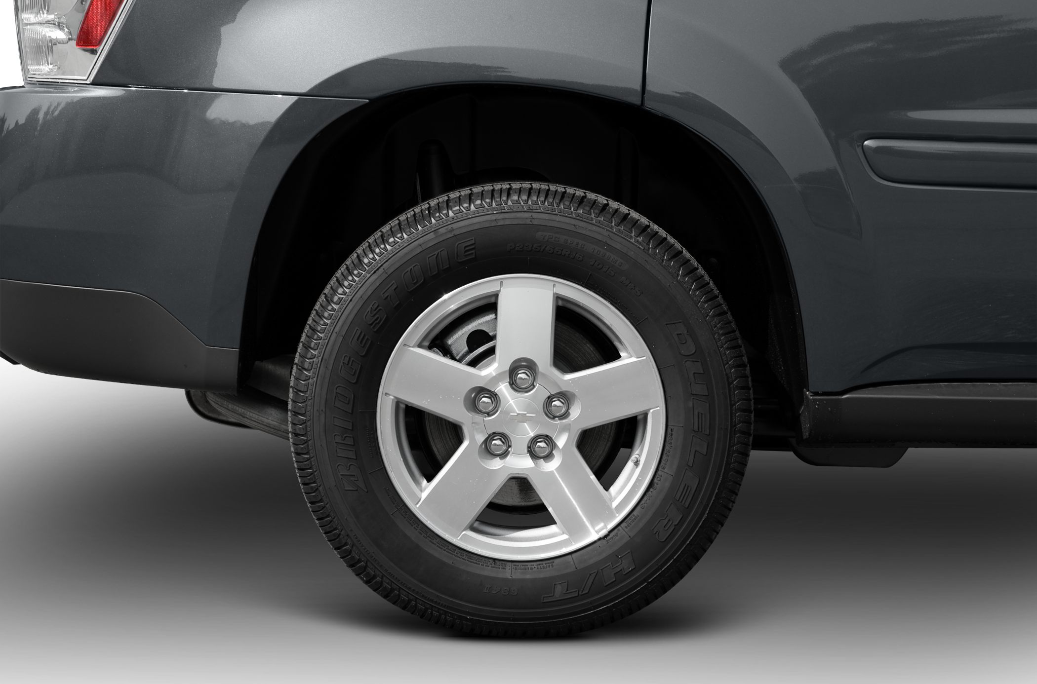 Close-up of 5-spoke alloy wheel with Bridgestone Dueler H/T tire
