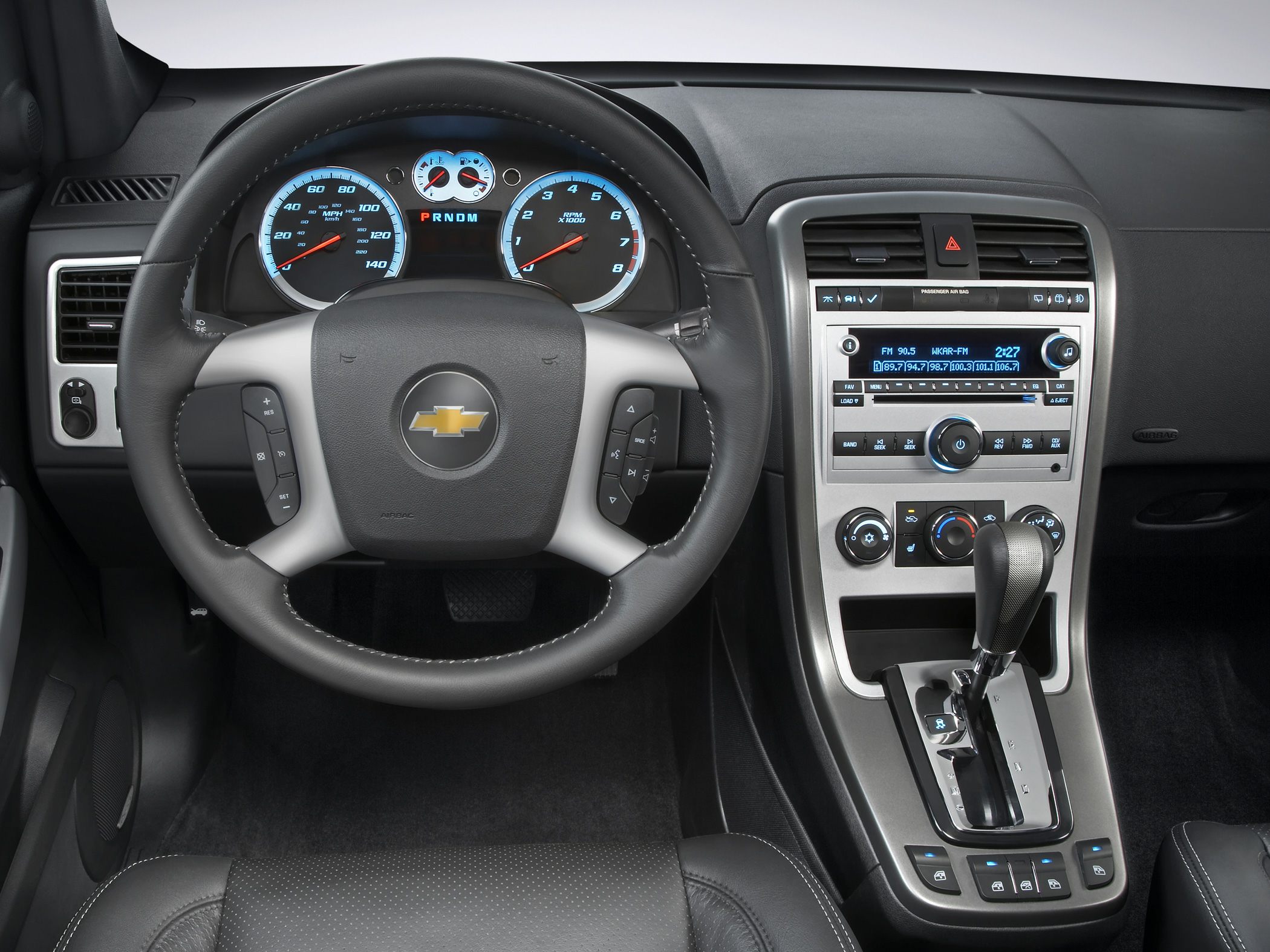 Digital instrument cluster, multifunction steering wheel, gear shift lever