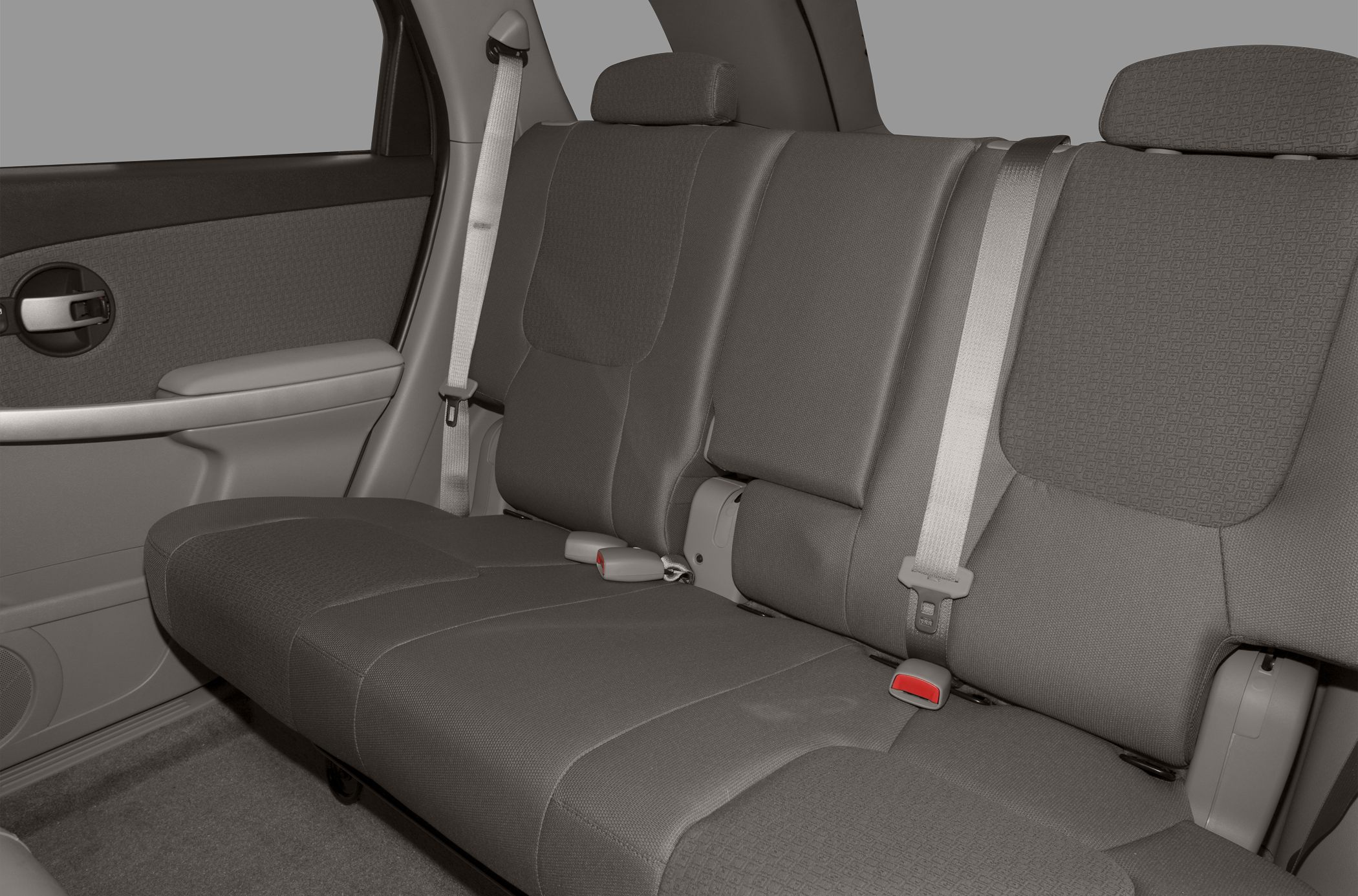 Rear seat upholstery and seat belts in car interior