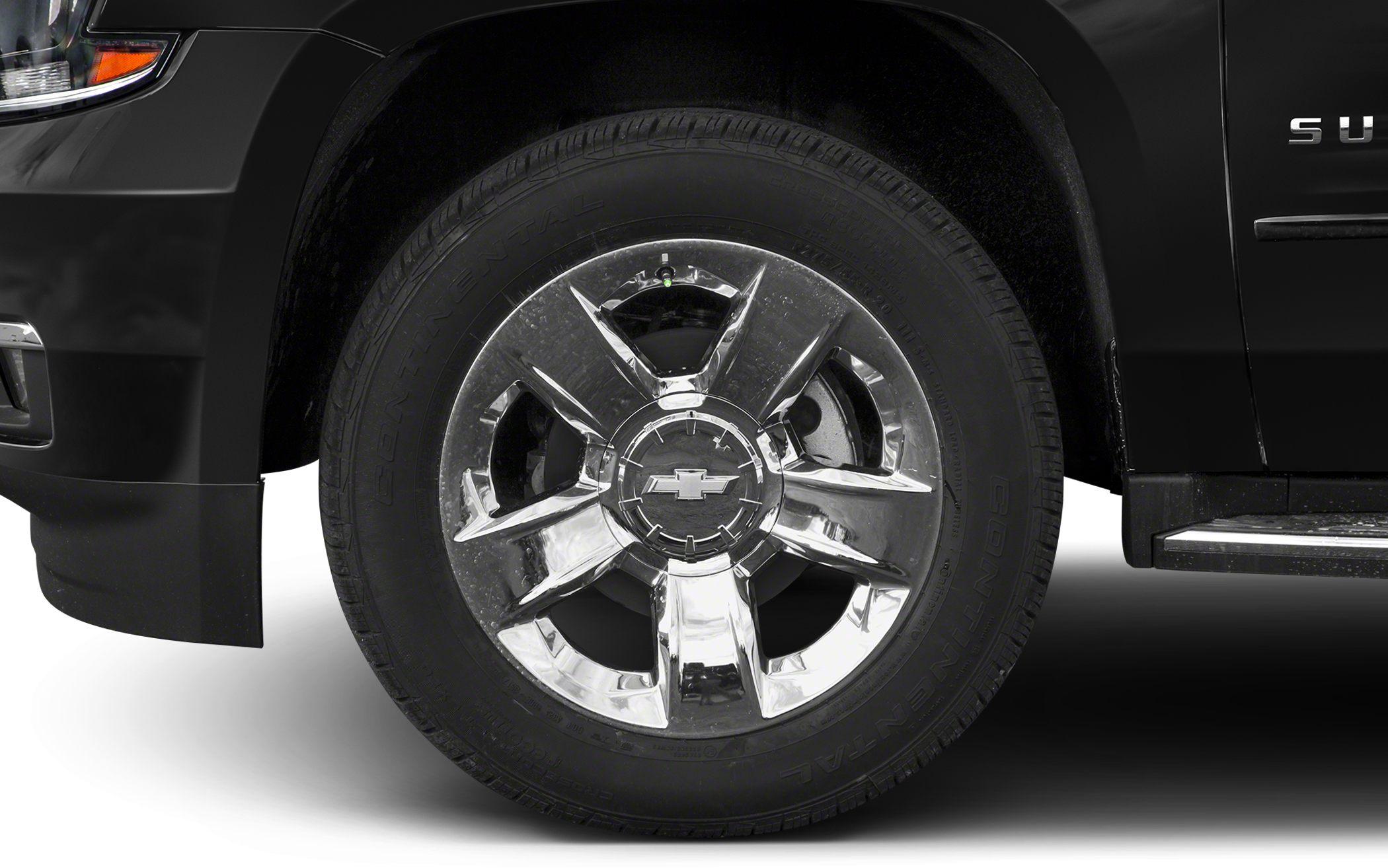 Chrome wheel and tire close-up with visible rim design and tire tread