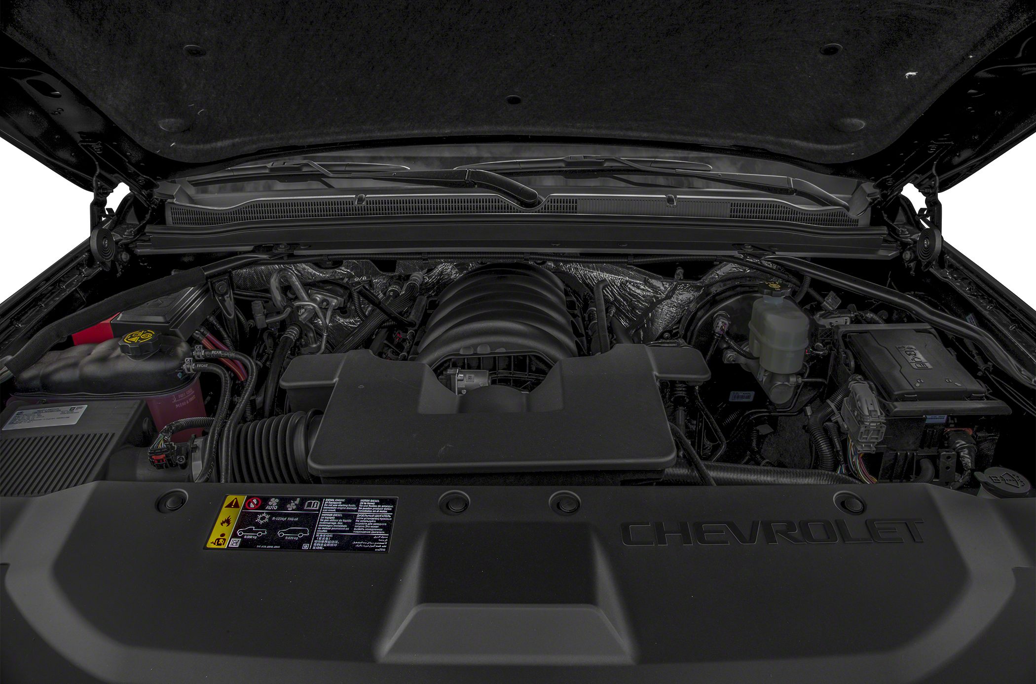 Close-up of Chevrolet SUV engine compartment with visible engine and components
