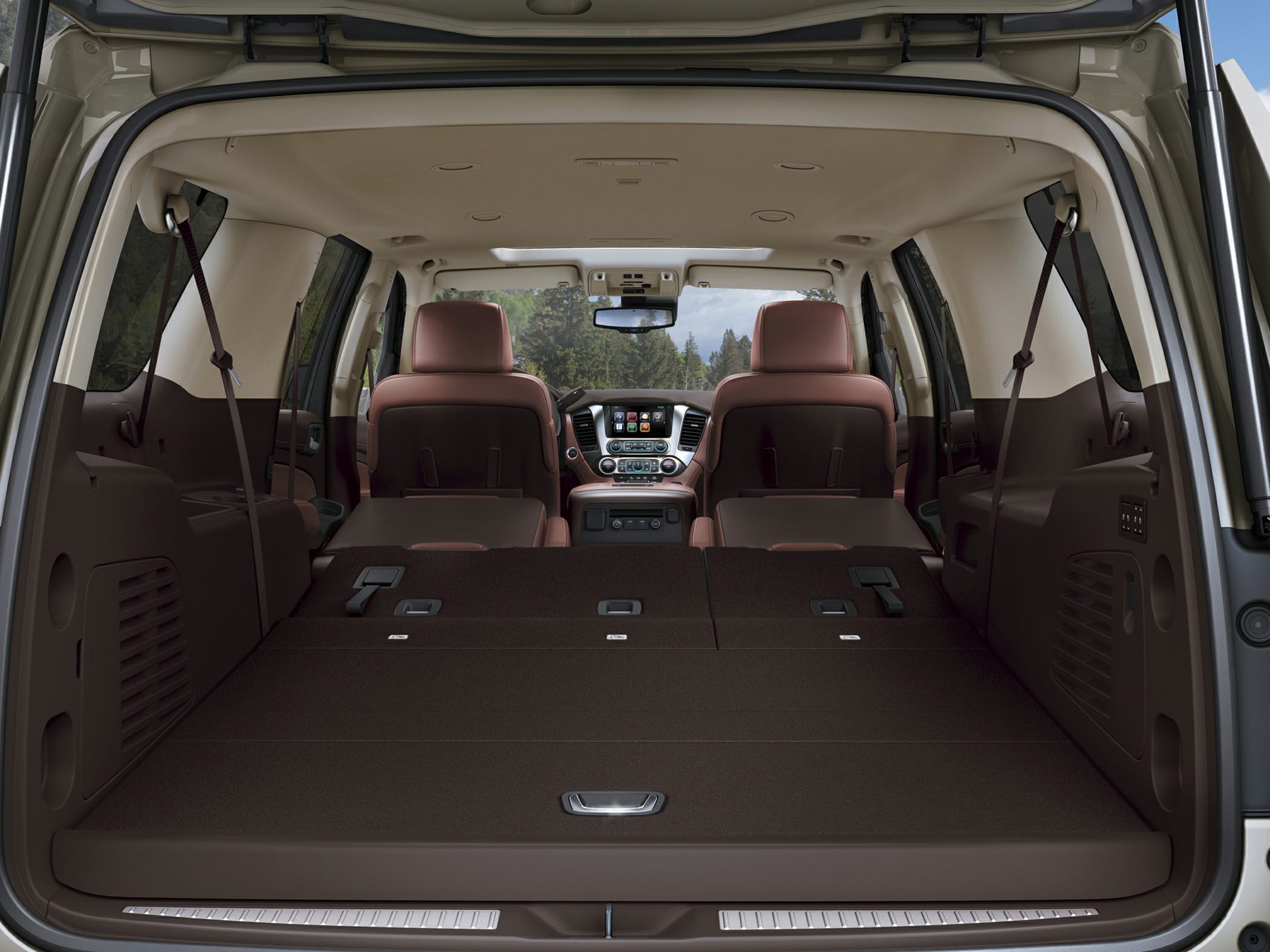 Folded rear seats and expansive cargo space inside SUV interior