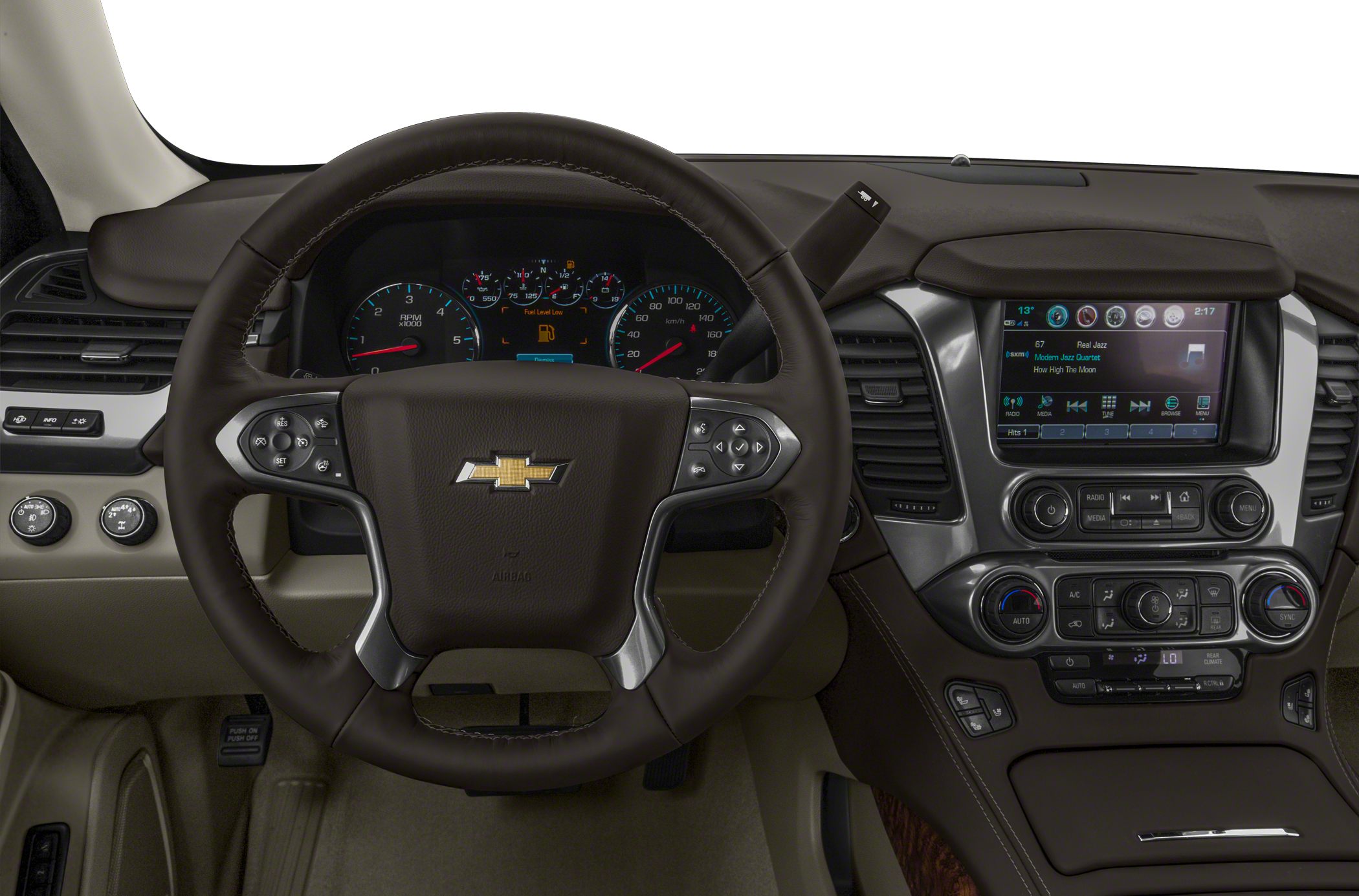 Steering wheel and dashboard with infotainment and control buttons