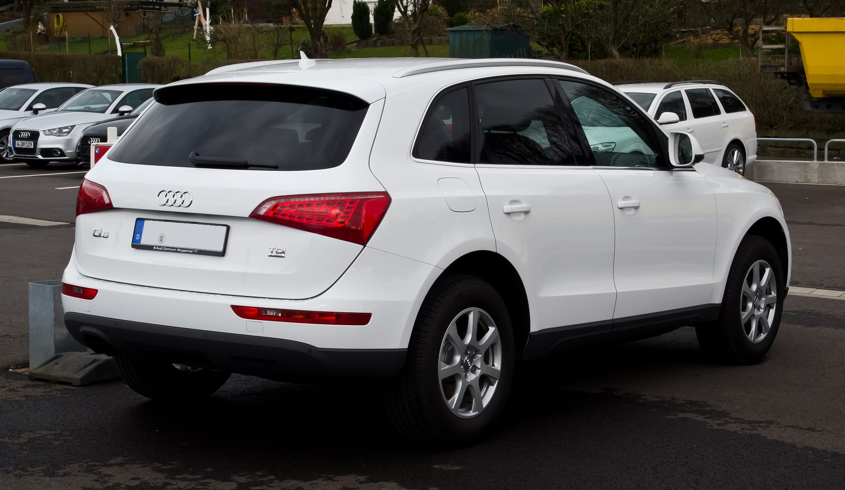 Rear view of white SUV with LED tail lights and alloy wheels