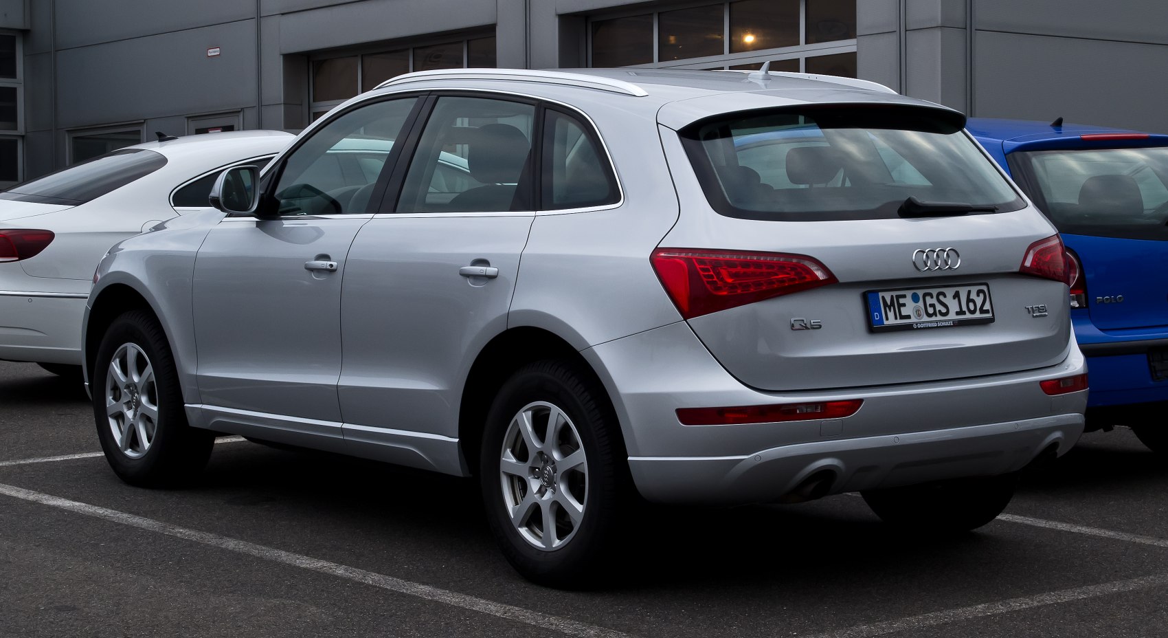 Silver SUV rear and side with distinct taillights and alloy wheels