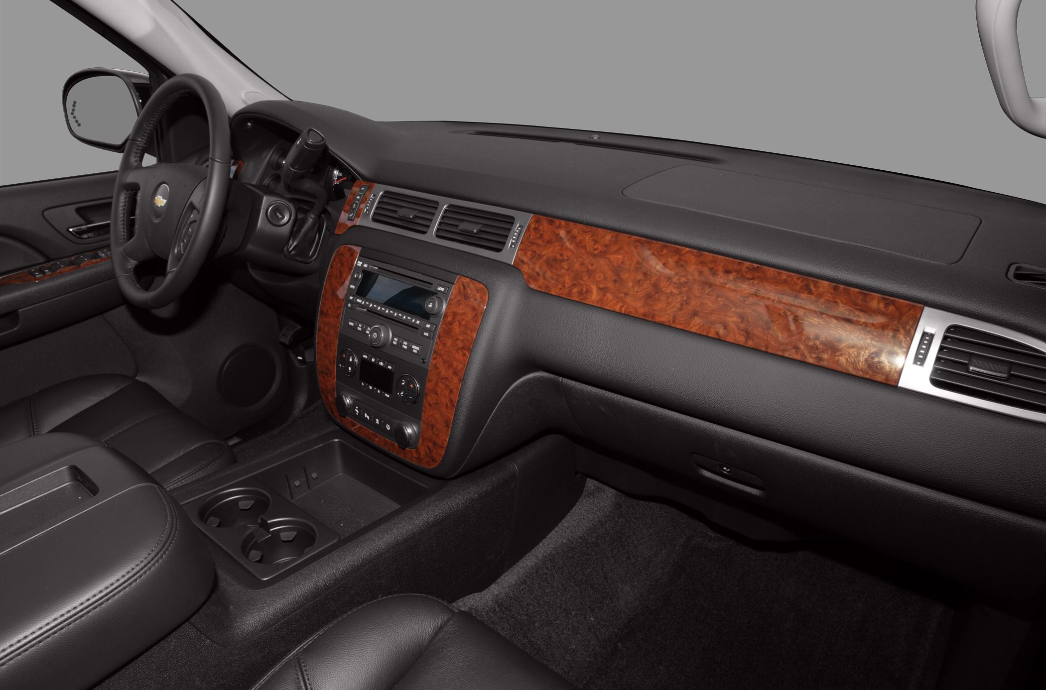 Wood trim dashboard and center console with black leather seats