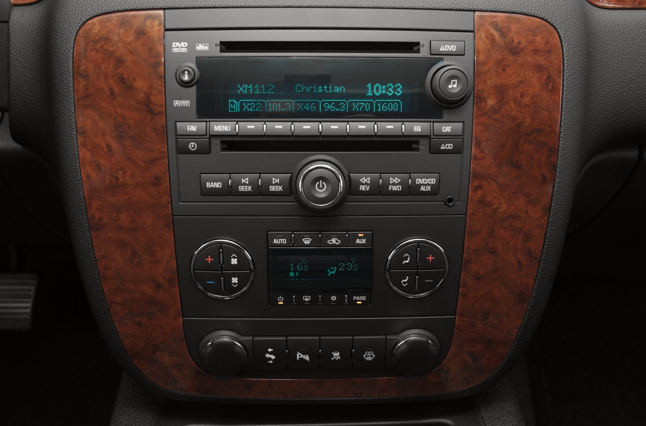Dashboard audio system and climate controls with wood grain trim