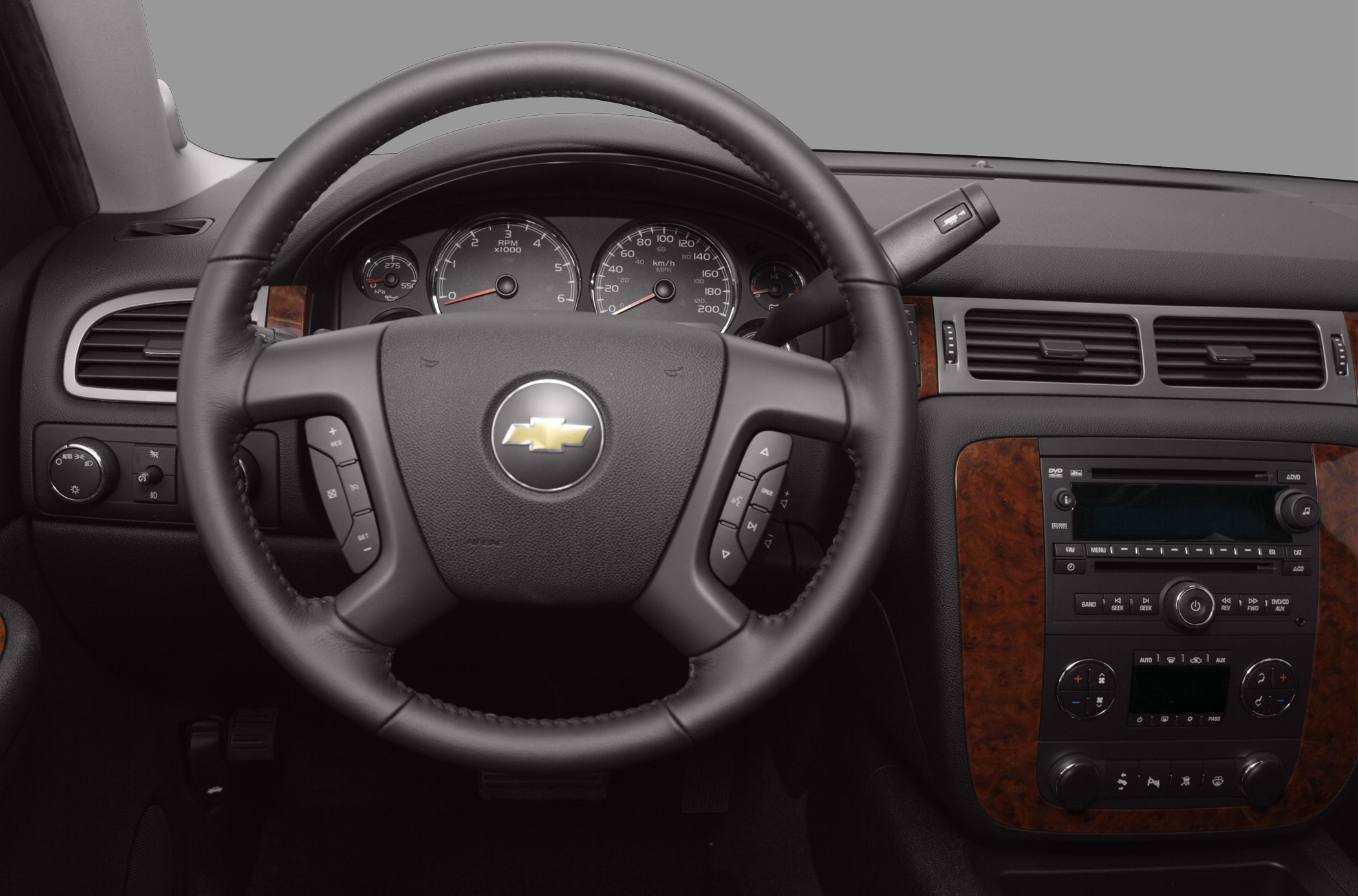 Steering wheel and dashboard with wood trim and instrument cluster