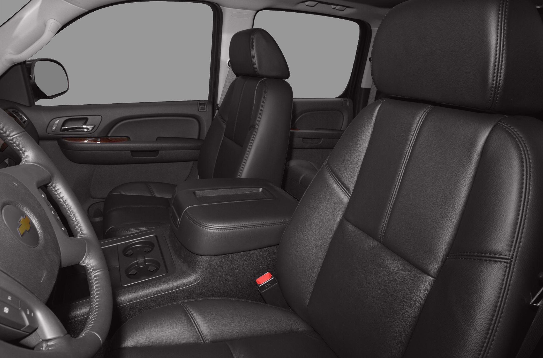 Black leather front seats and center console with door panel.