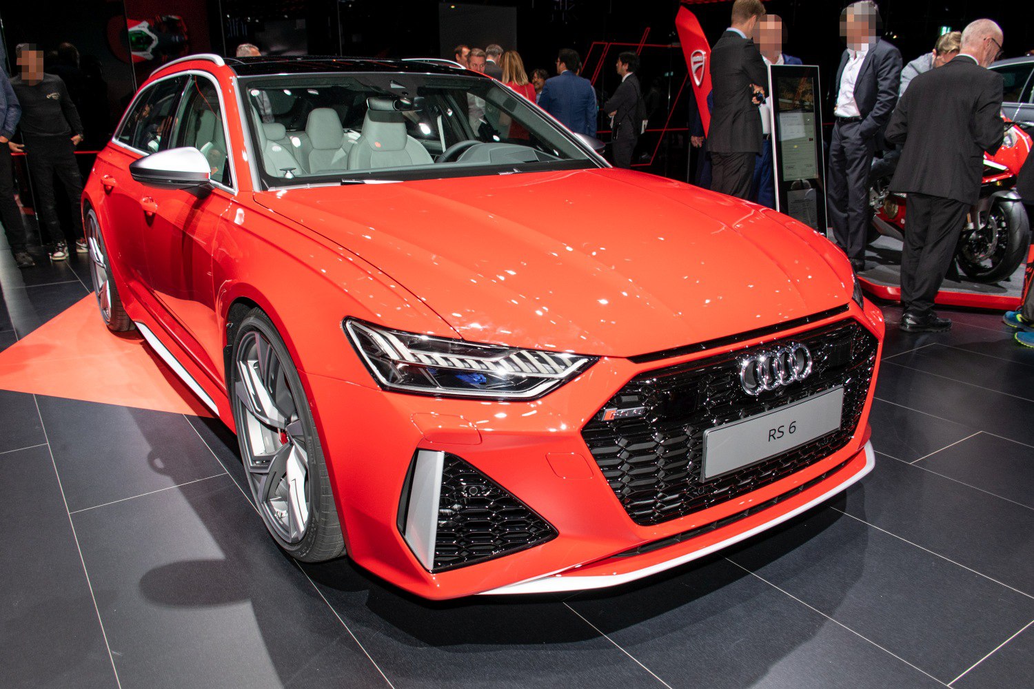 Front view with sleek headlights and black honeycomb grille