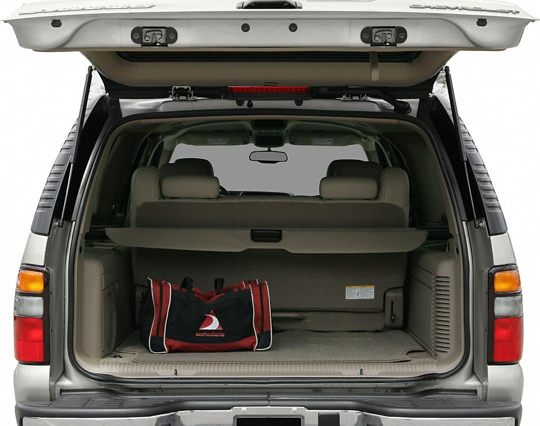 Open rear cargo area with beige interior and large storage space