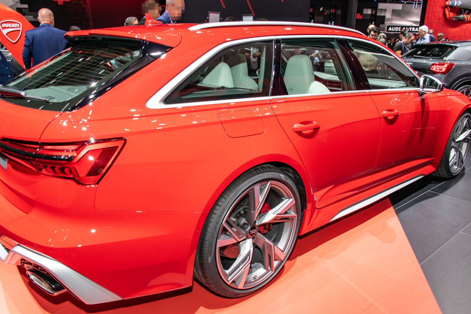 Red estate with aerodynamic rear side, alloy wheels, and dual exhaust