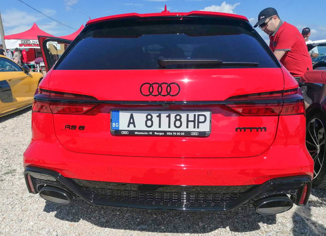 Rear of a performance estate with LED taillights and dual exhausts