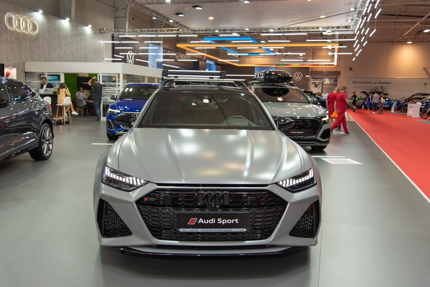 Front view of a sporty vehicle with roof rack and LED headlights