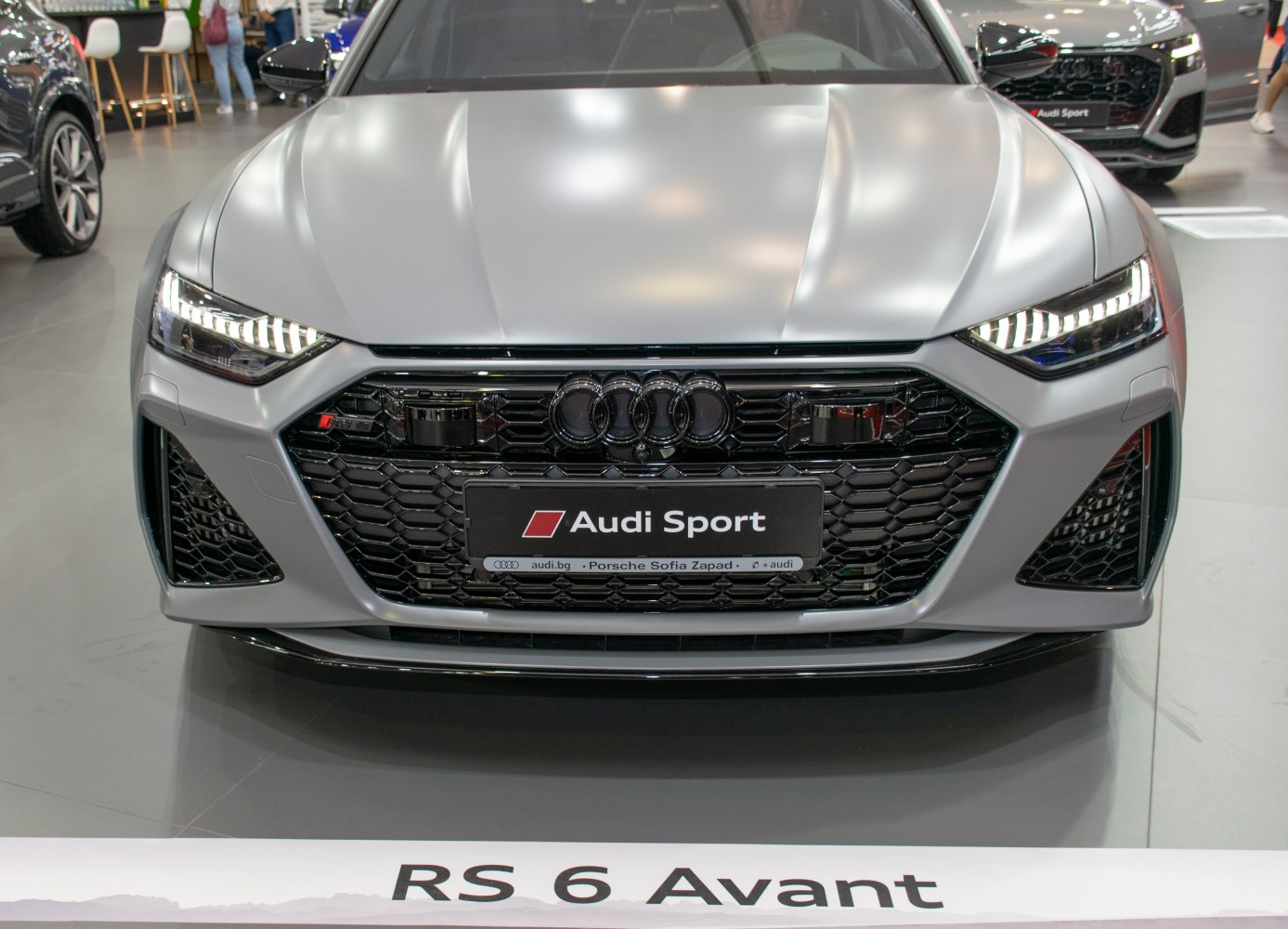 Front view with aggressive honeycomb grille and LED headlights