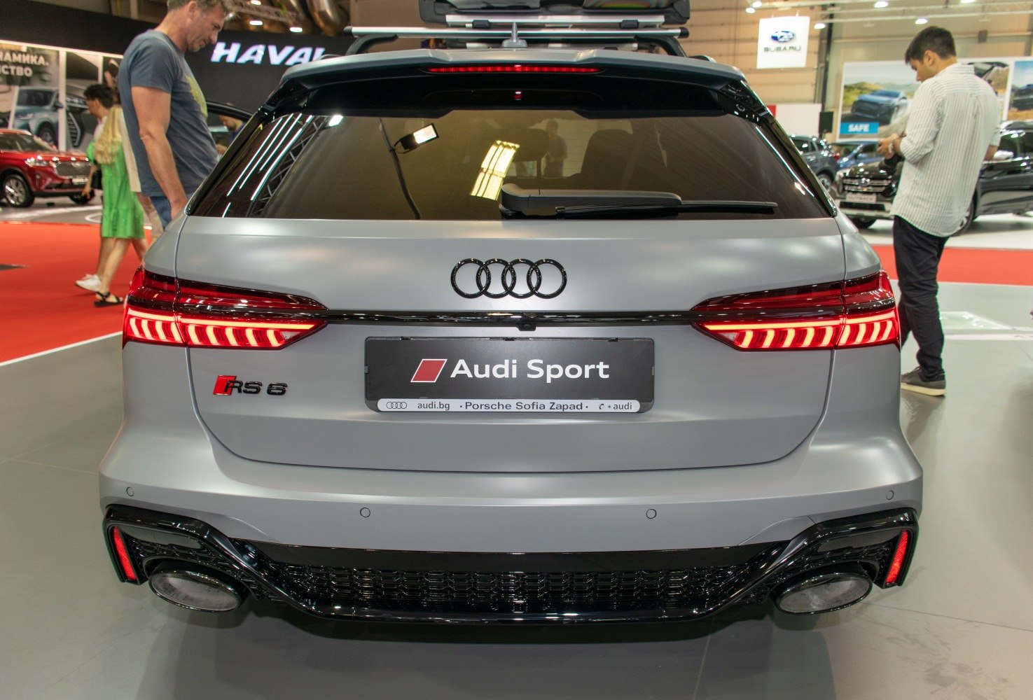 Rear view of a vehicle with LED taillights and dual large exhaust outlets