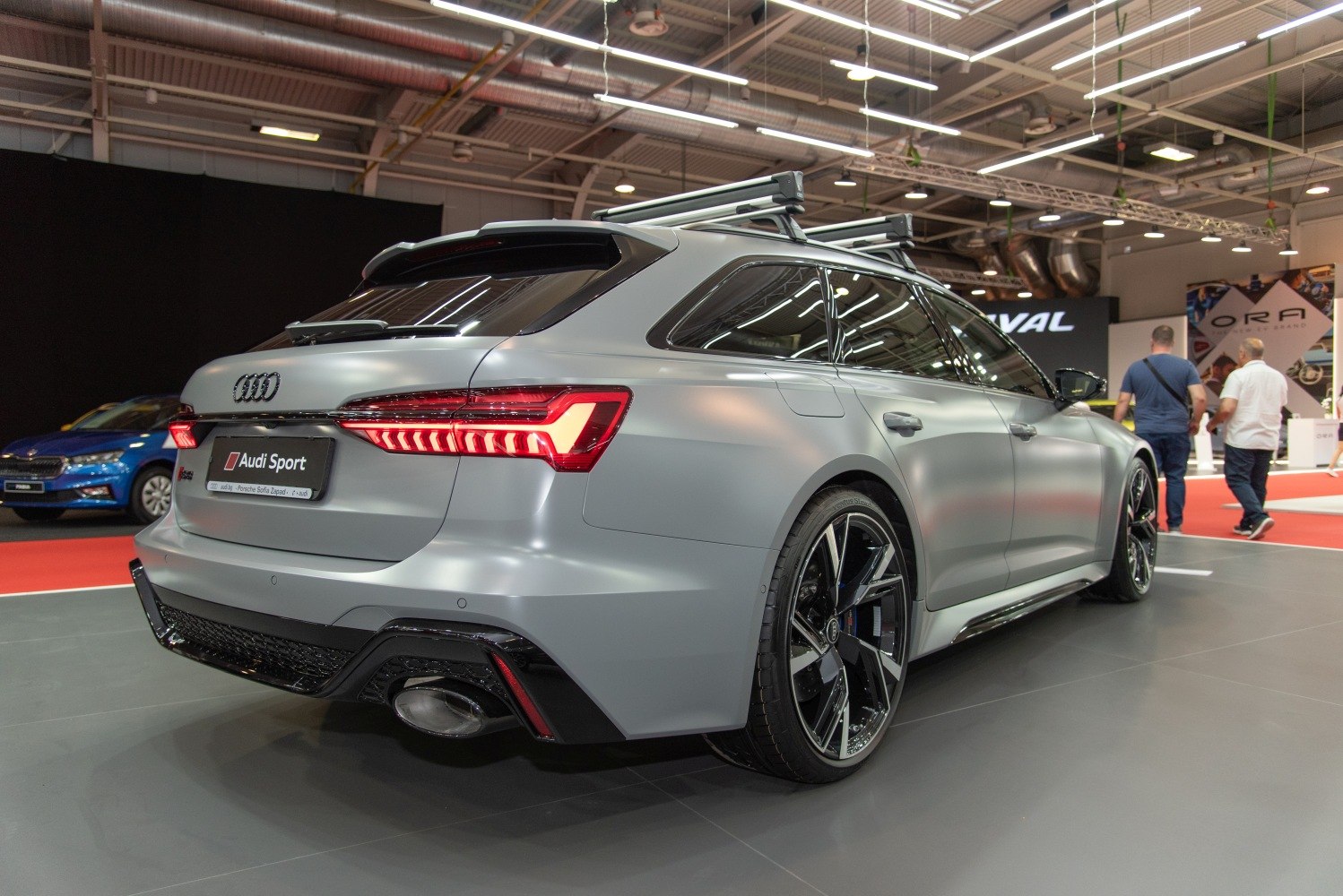 Rear view with distinctive taillights, sport alloy wheels, and roof rack