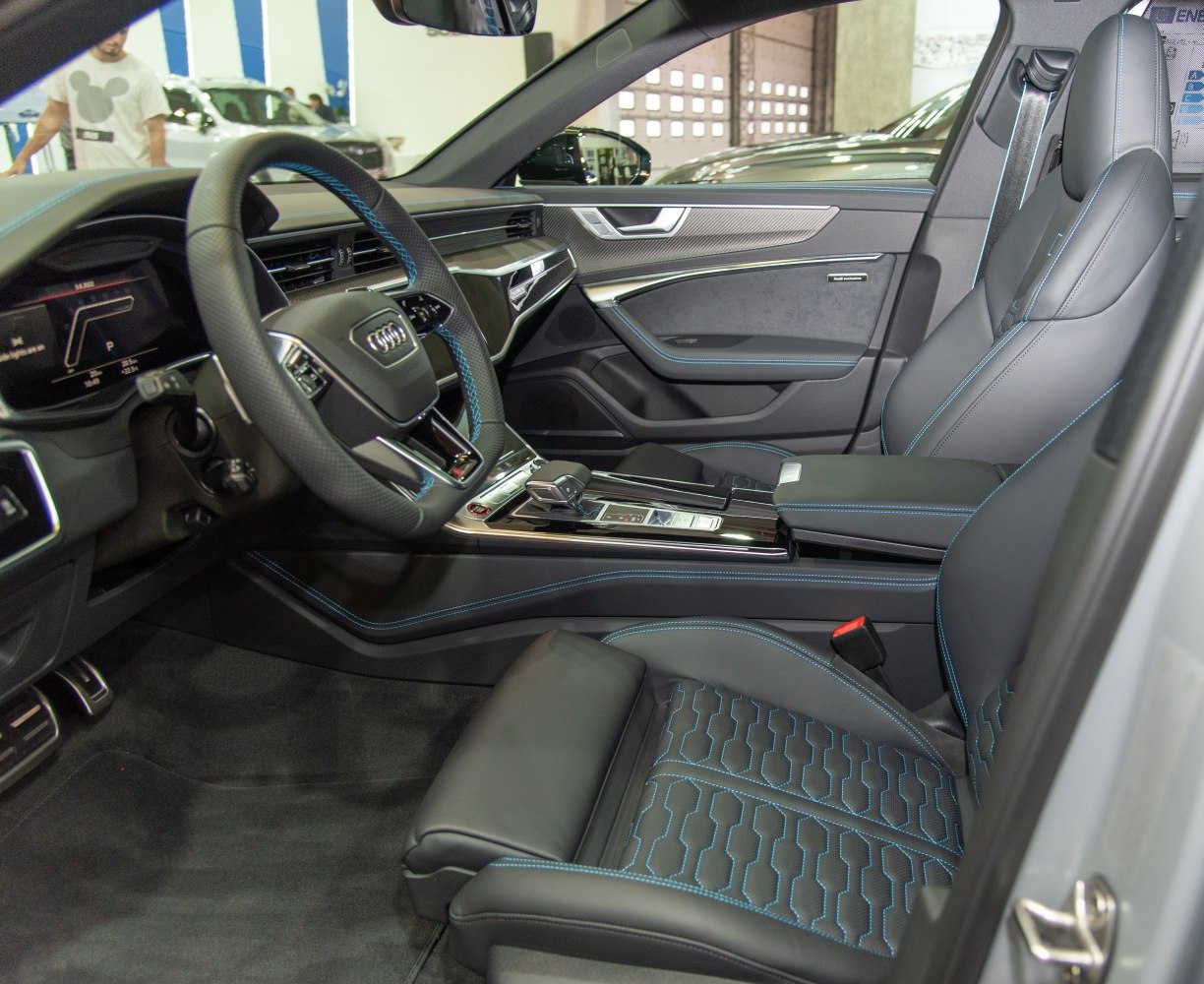 Black leather interior with blue stitching and advanced dashboard