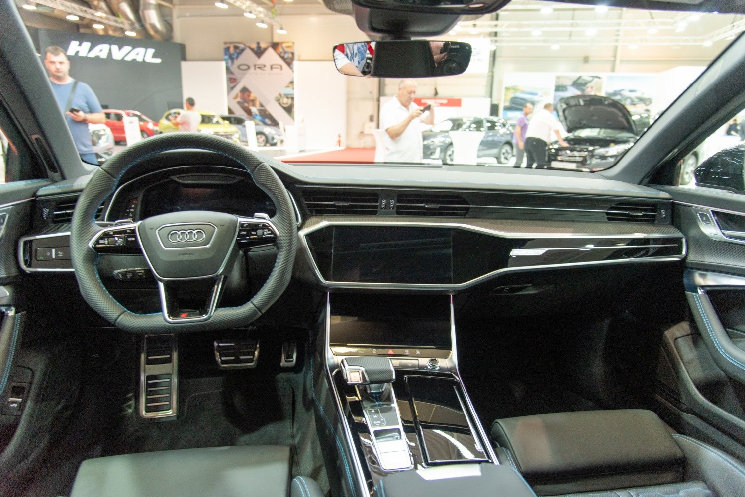 Audi interior dashboard with digital displays and multifunction steering wheel.