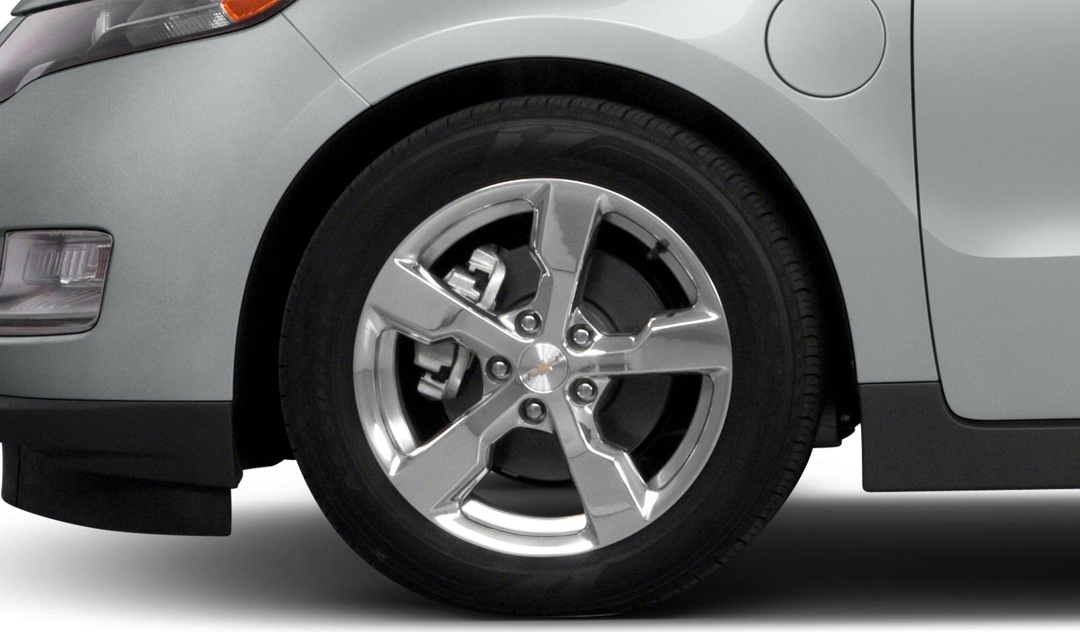 Five-spoke alloy wheel with visible brake caliper and tire close-up