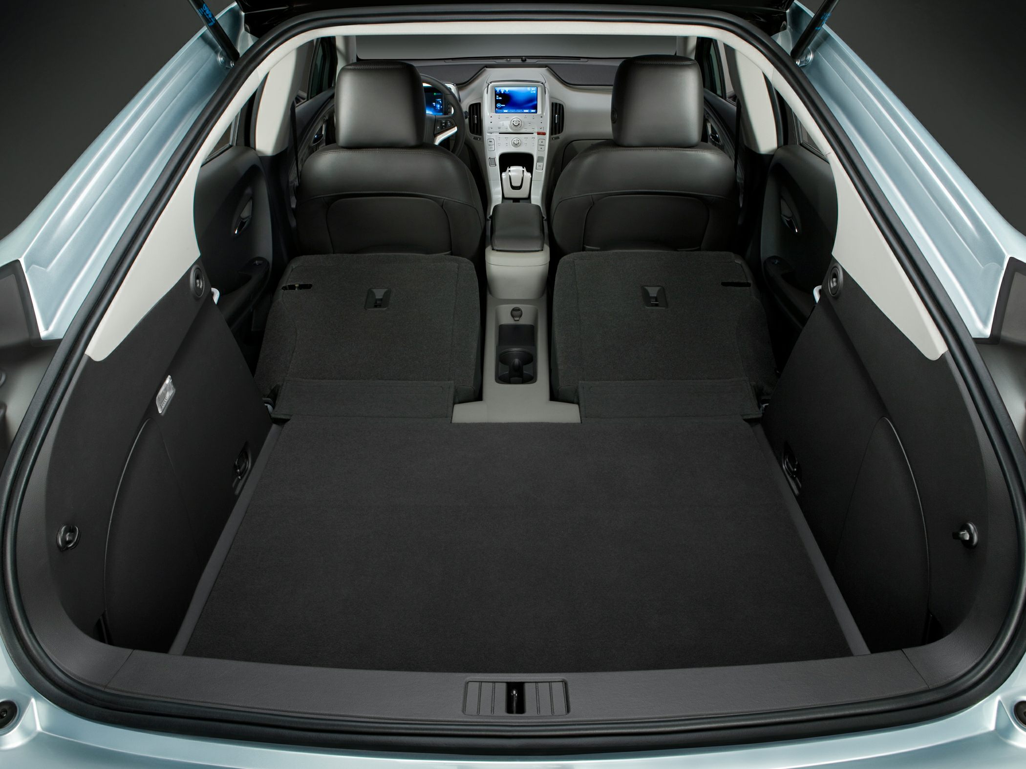 Folded rear seats and extended cargo area in car interior