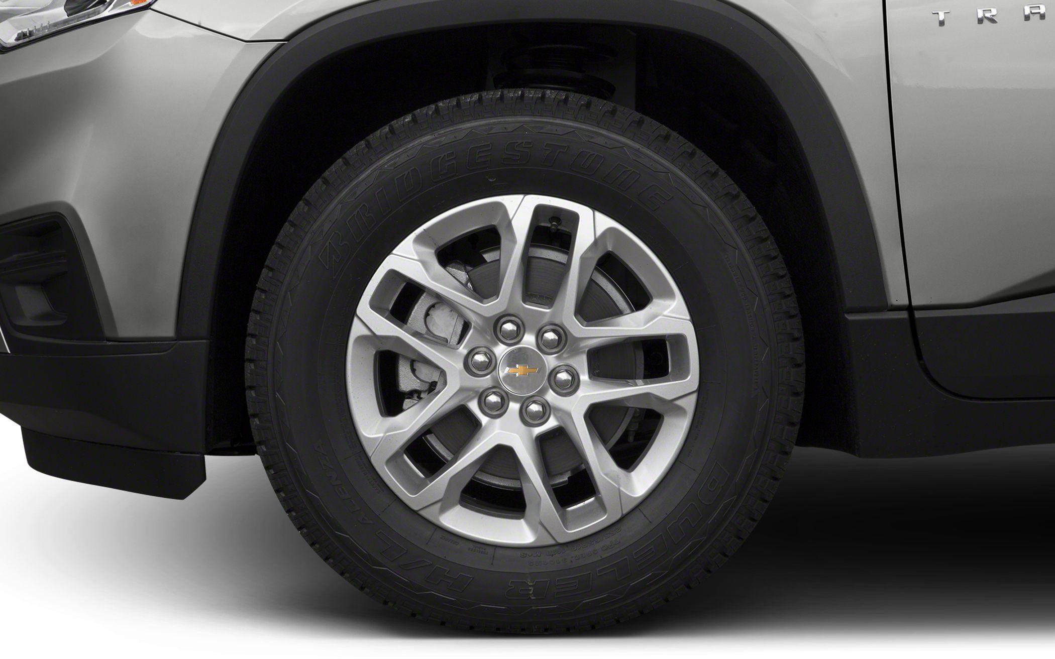 Alloy wheel and Bridgestone Dueler H/L tire close-up on an SUV.