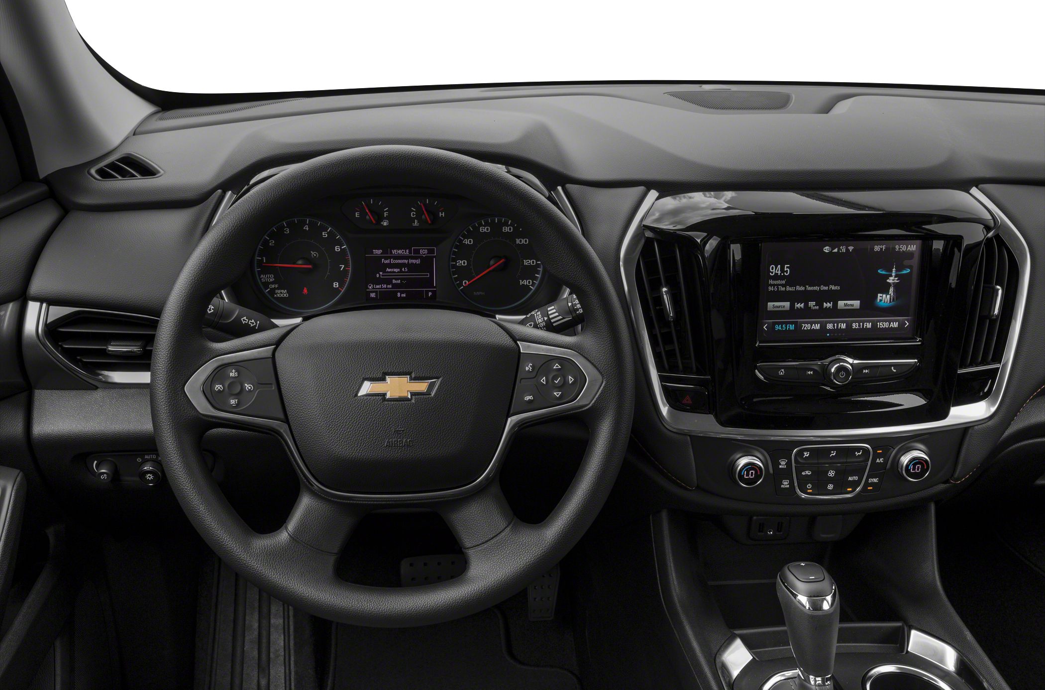 Dashboard, steering wheel, and infotainment system with climate controls in a vehicle.