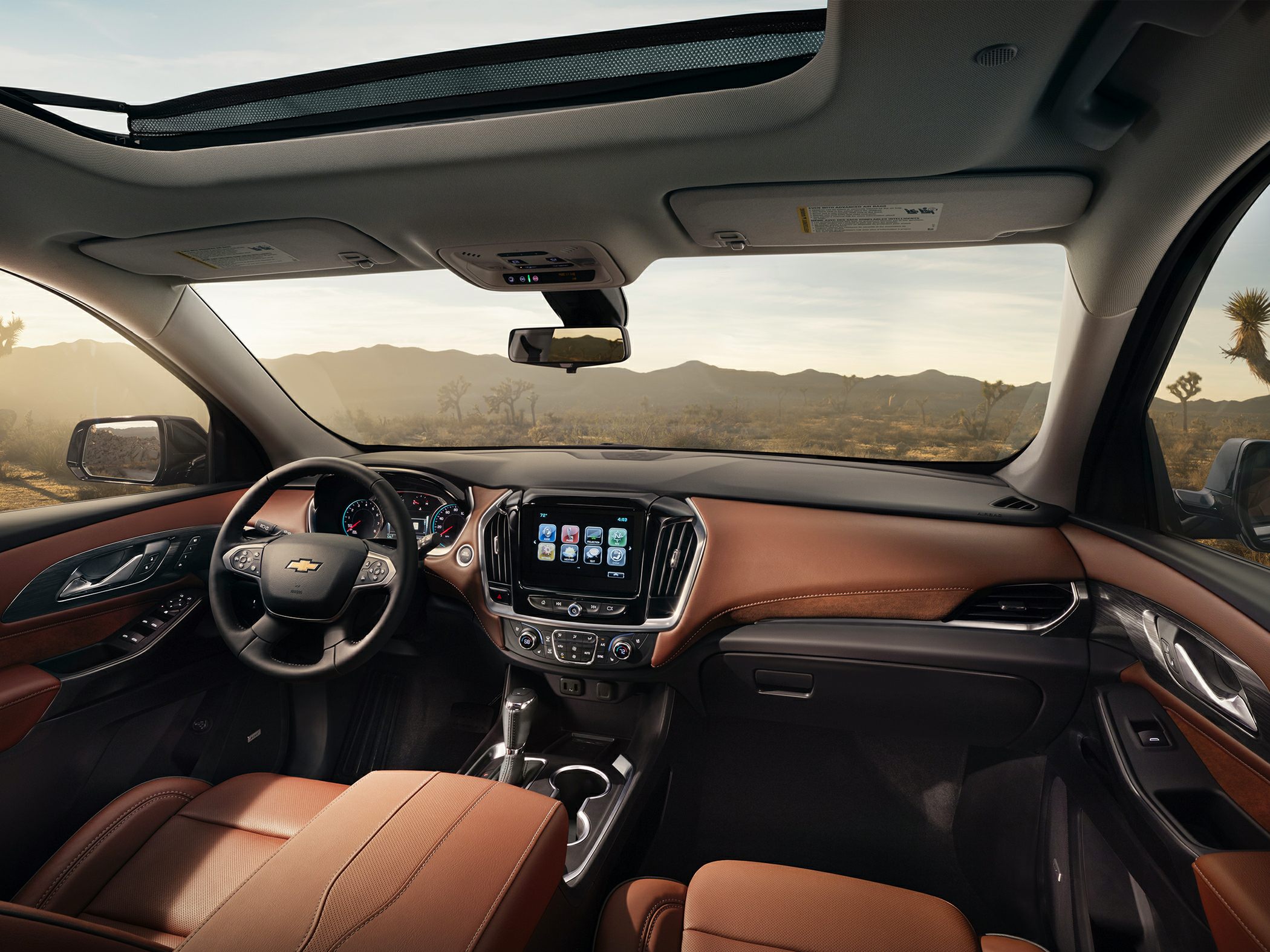 Brown leather seats, touchscreen infotainment, panoramic sunroof.