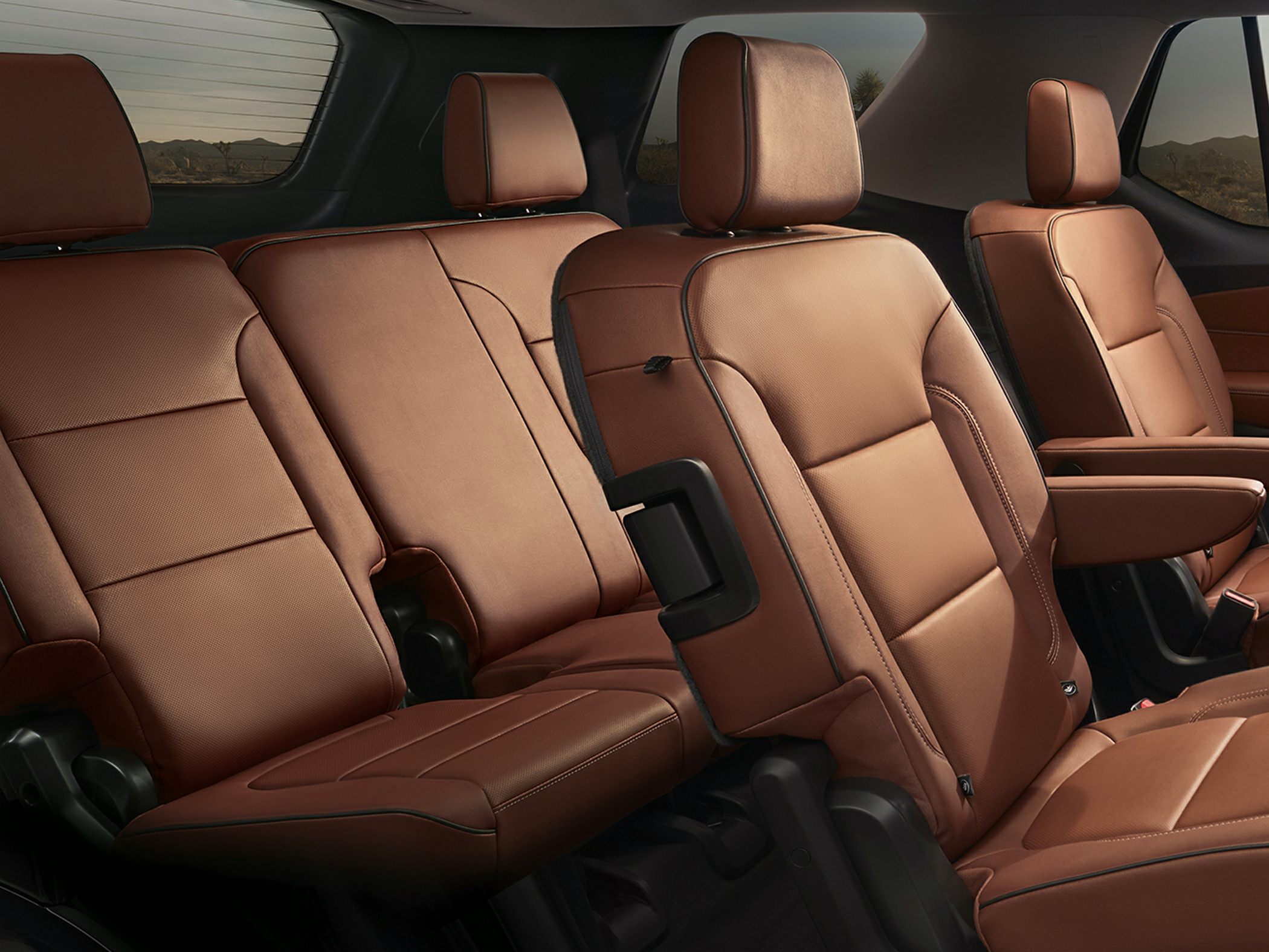Brown leather second and third-row seats inside SUV