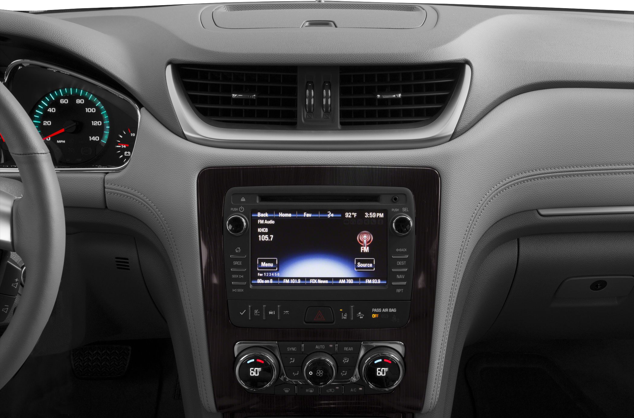 Center console with infotainment screen and dual climate control knobs