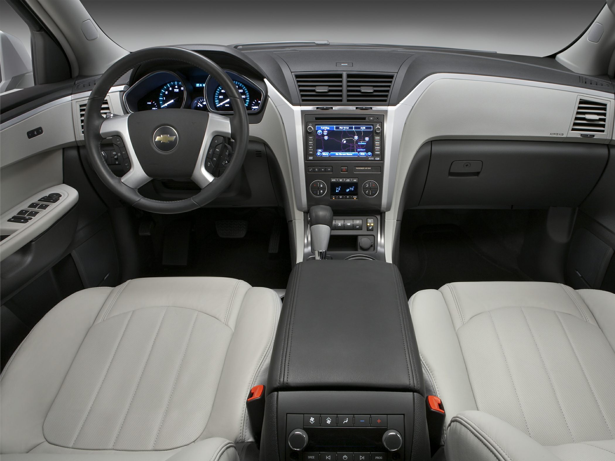 Dashboard with steering wheel, navigation screen, and center console controls