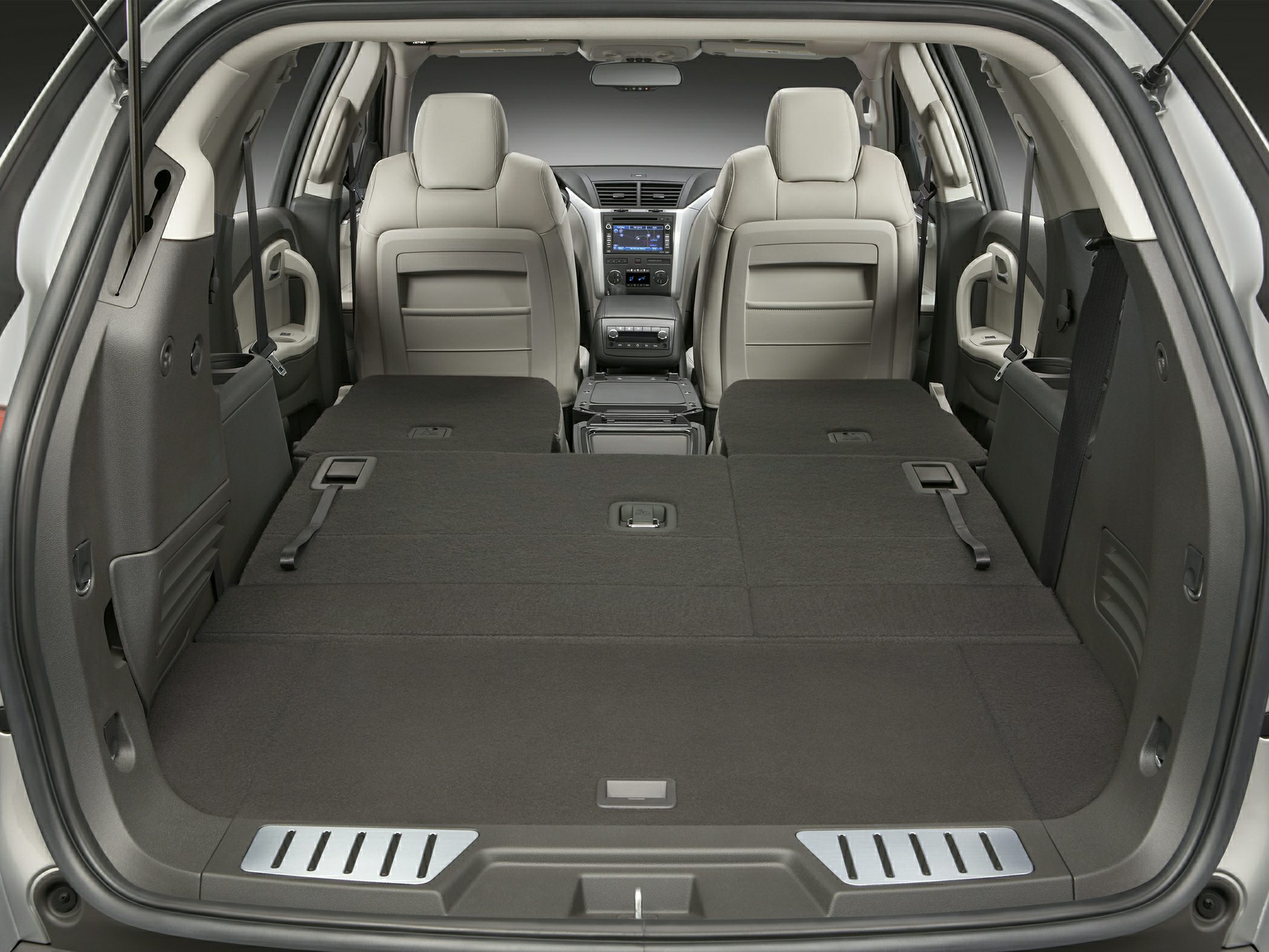 Folded rear seats with large flat cargo area in vehicle interior