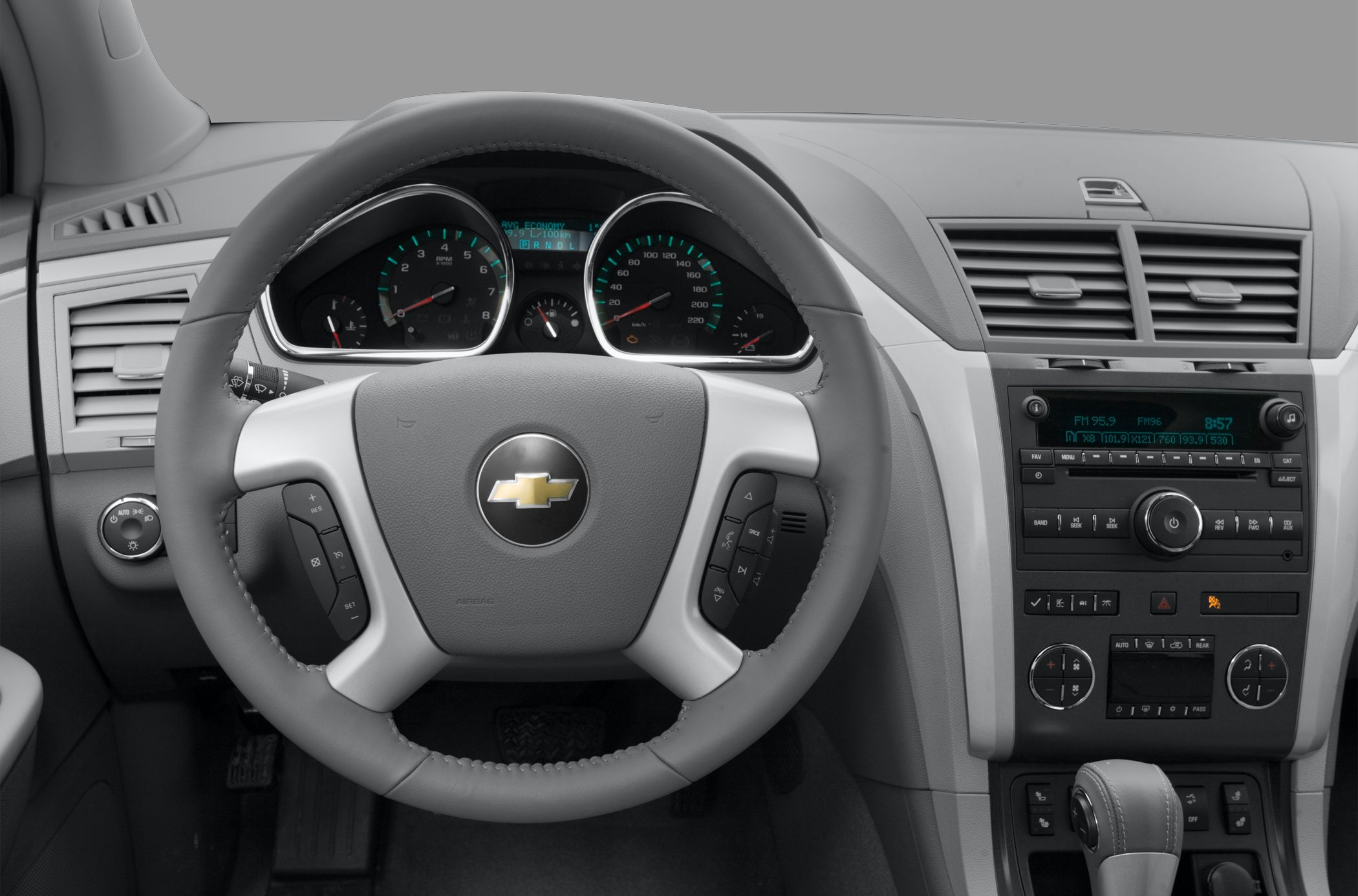 Dashboard with steering wheel, instrument cluster, and center console controls