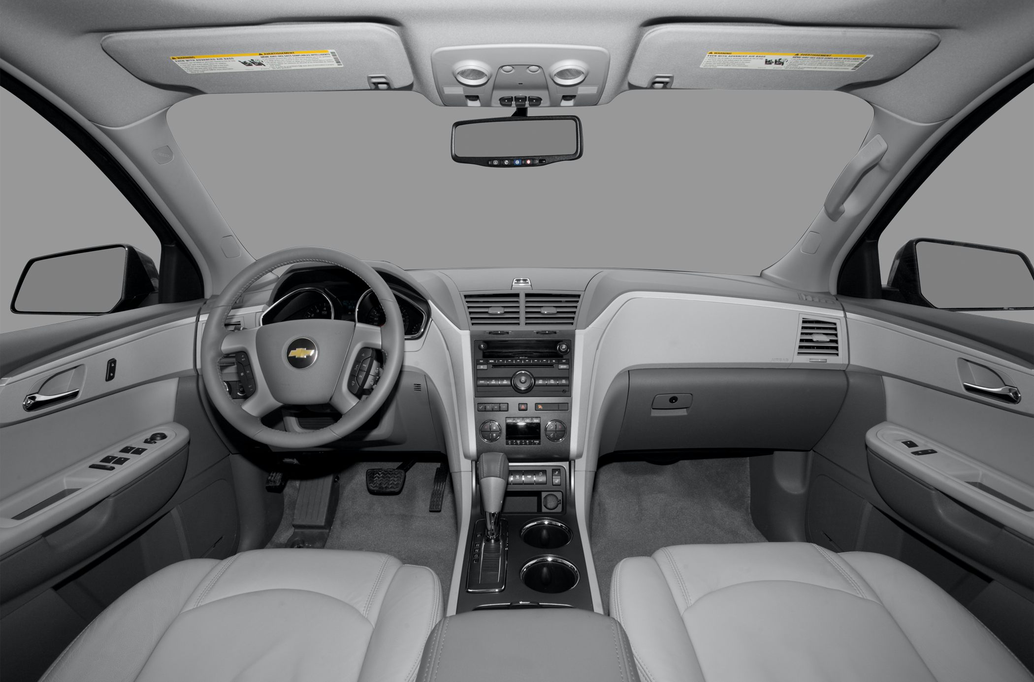 Dashboard, steering wheel, center console, and front seats of a vehicle interior