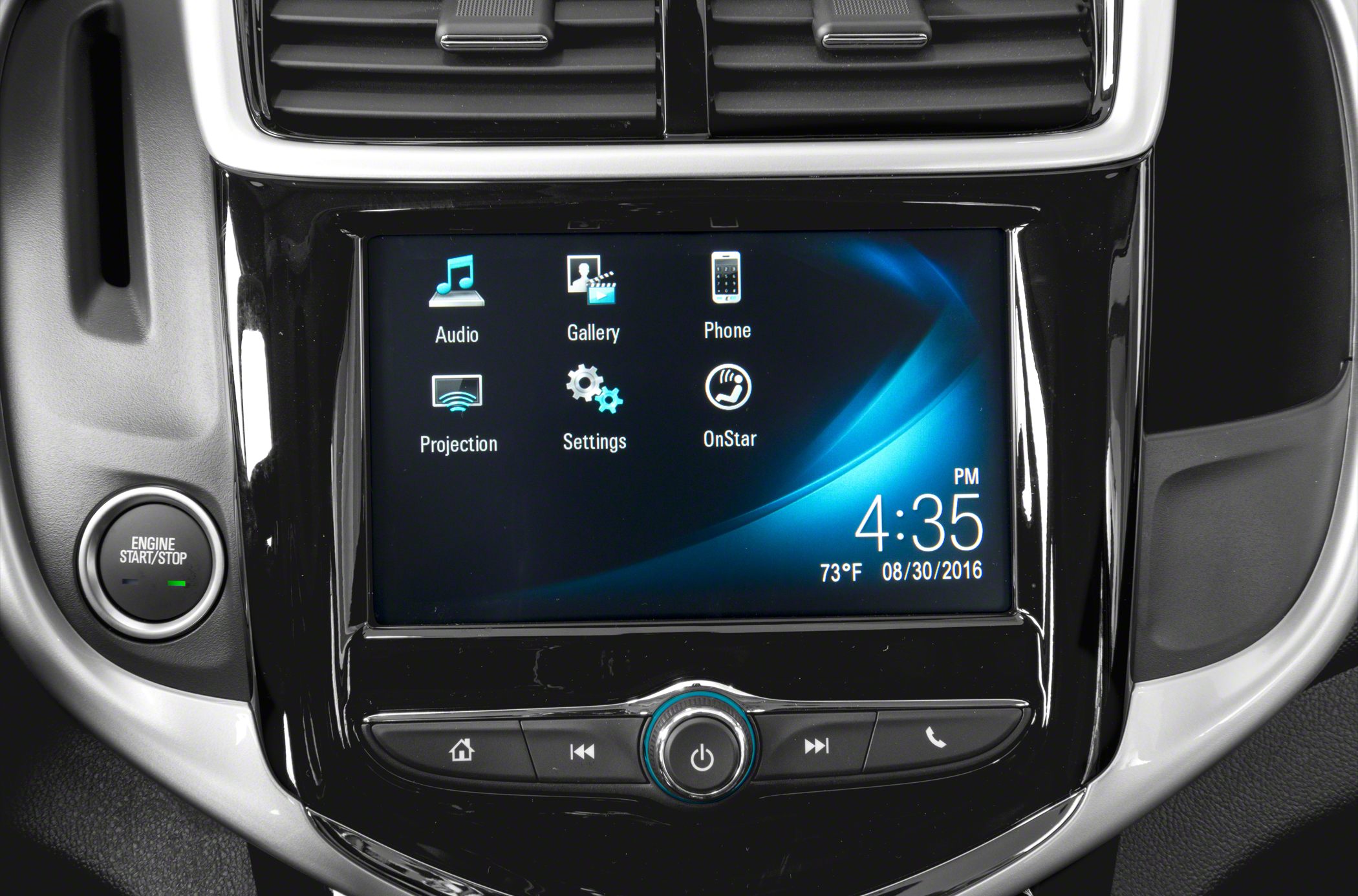 Car infotainment touchscreen and engine start/stop button close-up