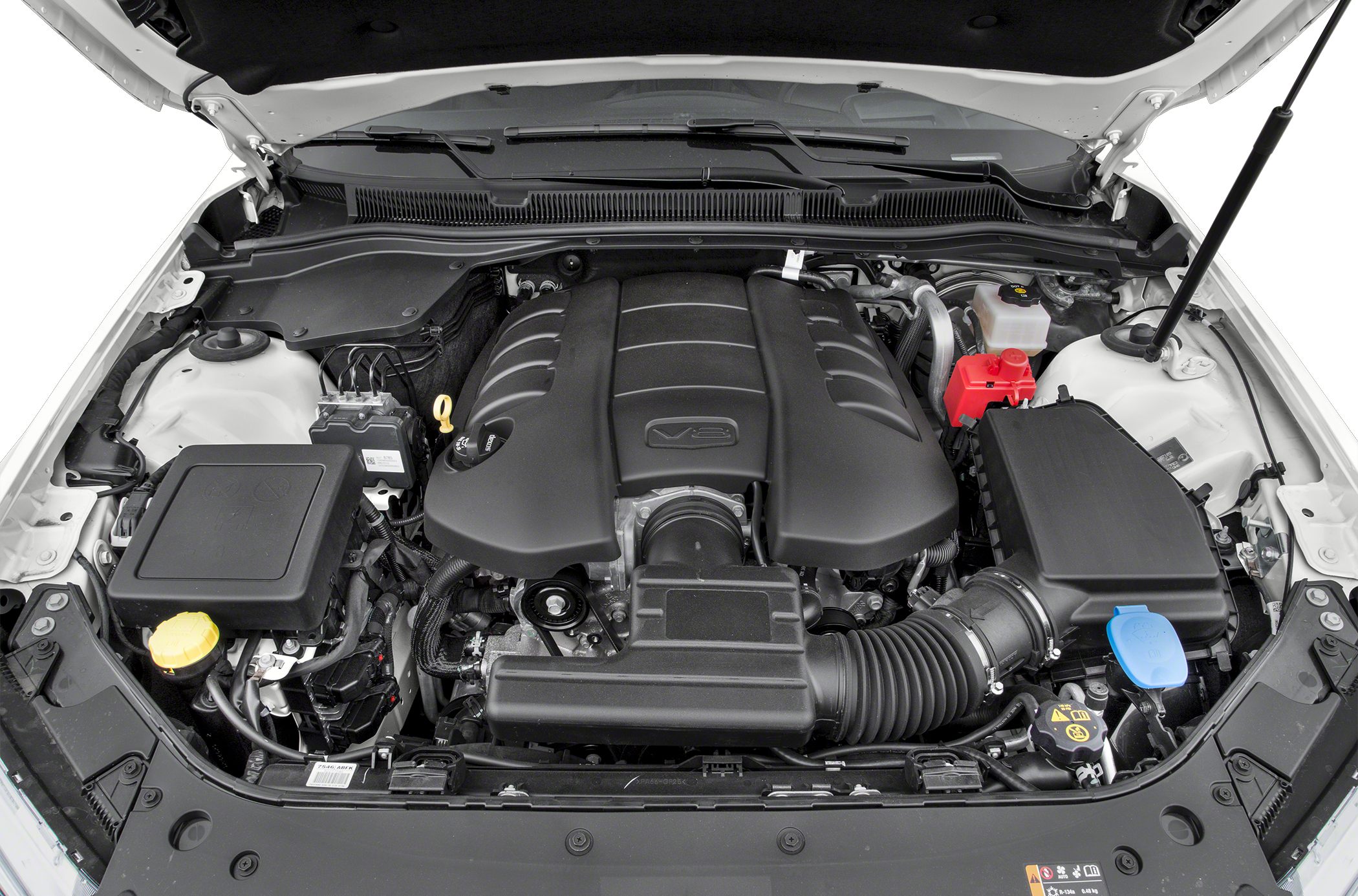 V8 engine bay with large black engine cover and visible intake system