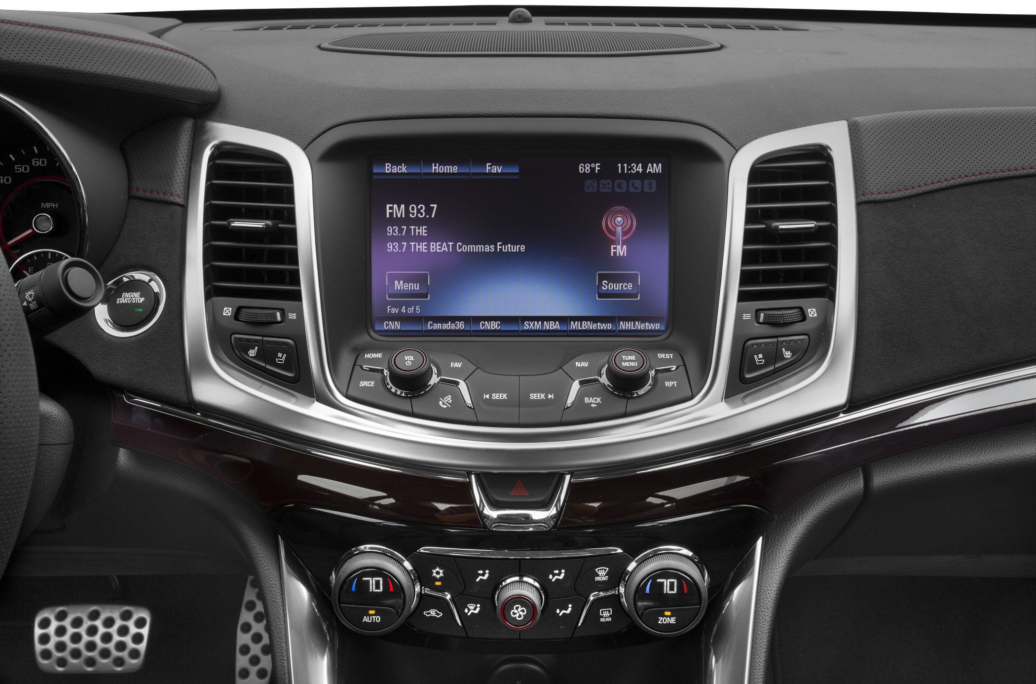 Dashboard with central touchscreen and climate control knobs